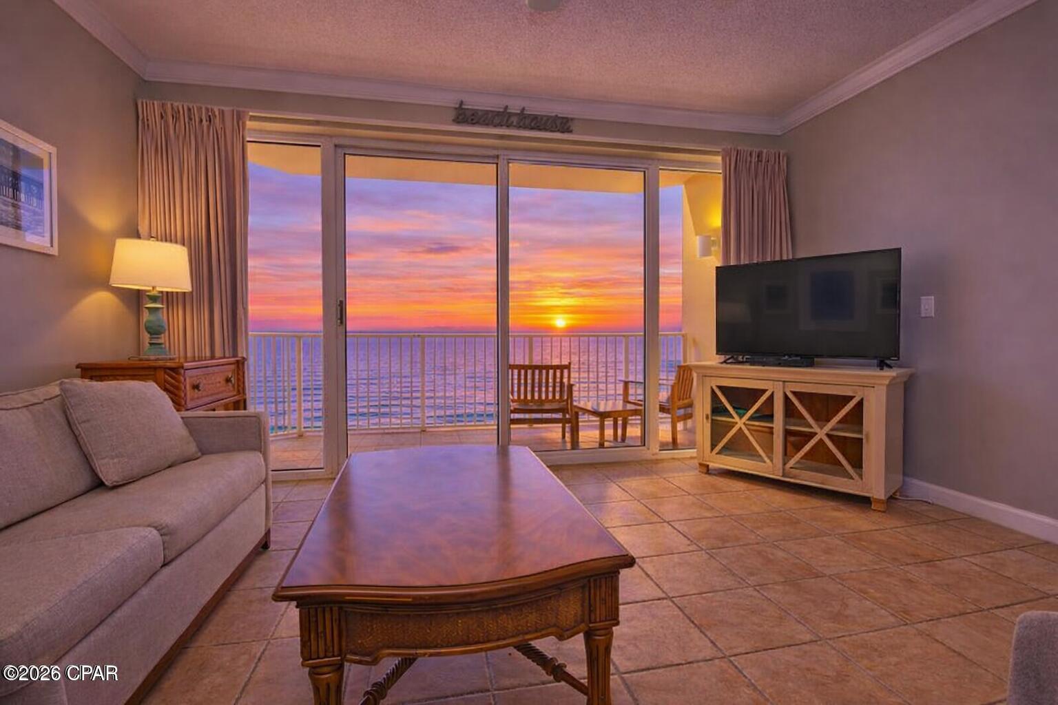 1BR/1BA Gulf-front condo in Boardwalk Central in Panama City Beach. Gulf-view balcony and built-in hallway bunks. 745 sqft, built 2005, located on the 14th floor of a 22 story high rise.

Unit 1406D at Boardwalk Central in Panama City Beach offers a 1 bedroom, 1 bathroom Gulf-front condominium with 745 square feet of heated and cooled living space and a list price of $375,000. Located on the 14th floor of a 22 story building constructed in 2005, the unit provides Gulf views from the private balcony and direct beach access through the building. Short term rentals are permitted, offering flexibility for personal use, seasonal stays, or vacation rental income potential.

Inside the unit, the layout includes a primary bedroom, living room, kitchen, and a hallway bunk alcove with built in bunks designed to provide additional sleeping capacity. Tile flooring runs throughout the interior for easy maintenance. The kitchen features granite countertops and an extended breakfast bar that accommodates seating for dining or casual gatherings. Crown molding and elevated ceilings add definition to the main living areas while balcony access allows natural light and Gulf views.

Major systems include central heating and cooling with electric service, ceiling fans, and kitchen appliances including refrigerator, electric cooktop, oven, dishwasher, microwave, and stacked washer and dryer. The building is constructed with concrete and stucco exterior materials and includes fire safety systems, gated entry, security monitoring, and controlled building access.

Boardwalk Central residents and guests have access to a Gulf-front pool deck with a freeform tropical pool, heated spa areas, sun decks, and seasonal food and beverage service near the pool area. Additional amenities include recreation facilities, meeting spaces, beach access points, and community gathering areas designed for coastal condominium living.

The property is located along South Thomas Drive in Panama City Beach, placing it near restaurants, retail, entertainment venues, and beach access points throughout the central beach corridor.

The condominium is being offered furnished with immediate occupancy available. Quarterly homeowners association dues are currently $2,378.23 and include services such as cable TV, internet, water, sewer, trash service, exterior maintenance, pest control, building insurance, security, and professional management.