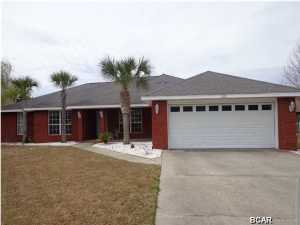 4 Bedroom, All BRICK, in-ground pool, custom built over 2200 square foot with Florida Room, Hardwood Floors, split bedroom plan, Granite counter tops and wood floors in living areas and tile in Kitchen and baths. Very close to Navy base, Pier Park and the Beach! with the best School district.
