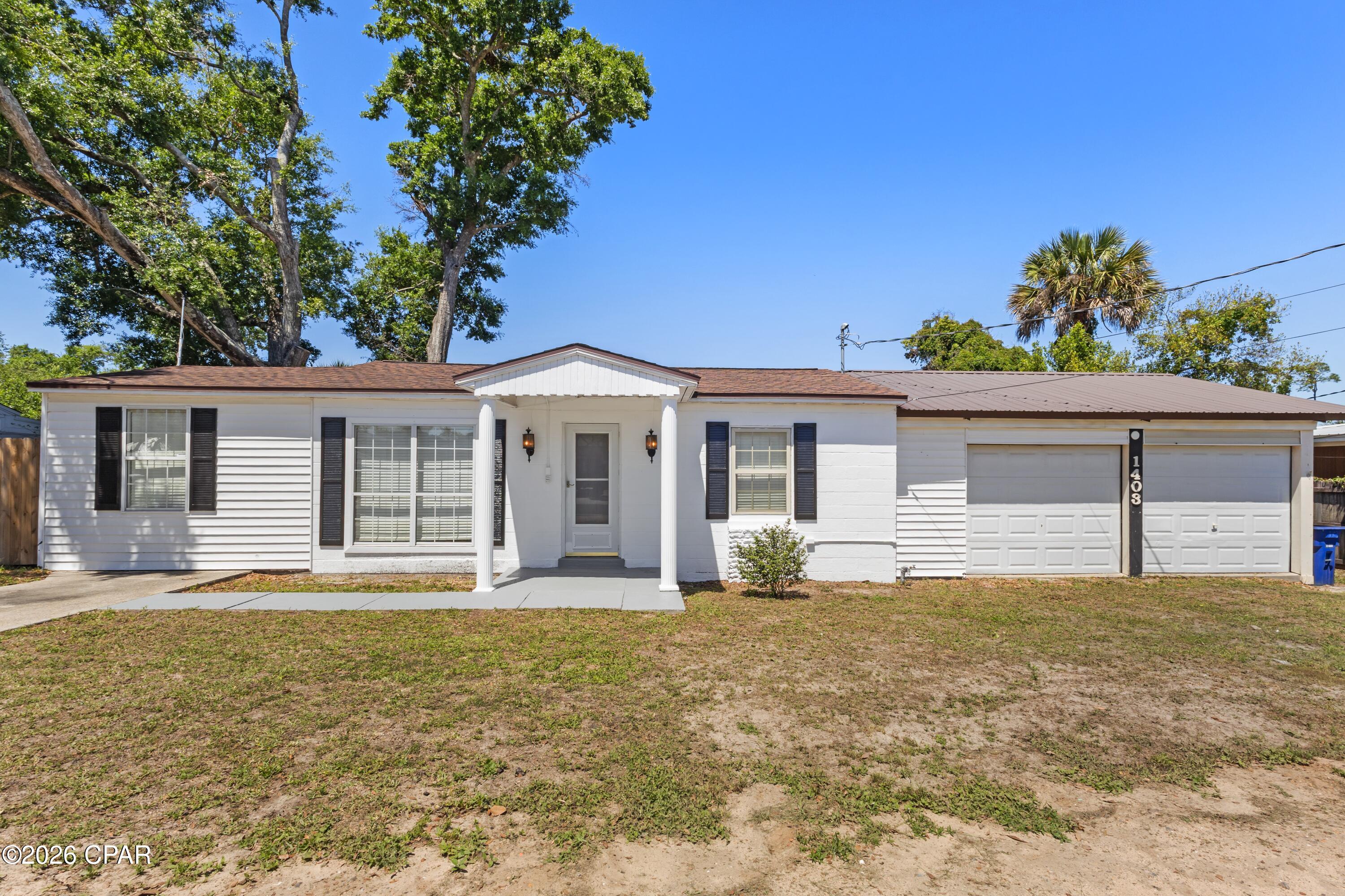 This updated Florida cottage puts you right in the middle of everything people love about living in Panama City. With 3 bedrooms, 2 bathrooms, and a layout designed for everyday living as well as entertaining, this home offers the kind of space and functionality that's hard to find at this price point. Natural light fills the interior, highlighting the updated flooring, newer appliances, and the well-maintained condition throughout. Major improvements have already been taken care of, including the HVAC system, roof, and water heater, all which have been replaced within the last few years for added peace of mind.

Outside, the home continues to impress with a screened-in patio, oversized deck, privacy-fenced backyard, and additional outdoor storage. The oversized true two-car garage provides plenty of room for vehicles, tools, beach gear, or hobbies. The street itself has recently been repaved and improved with new curbs and sidewalks adding to the overall appeal of the neighborhood.

Location is one of the standout features here. This home is less than five minutes from Beach Drive and the public beach access at Calhoun Beach Park and just minutes from Historic St. Andrews and Downtown Panama City.  You're also under 20 minutes from the white sandy beaches of the Gulf. Tyndall Air Force Base and the Navy Base are also both just a short drive away. Whether you're looking for a full-time residence, a second home near the water, or an investment opportunity with short-term rental potential, this property checks all the boxes for enjoying the Florida lifestyle year-round.