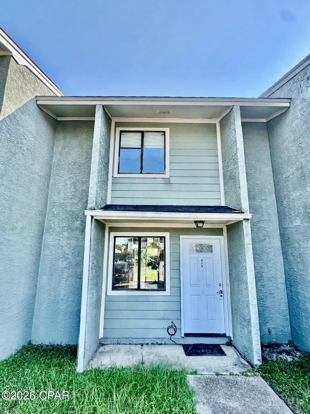 *EXISTING WINDOWS FEATURE NEWLY REPLACED GLASS** Centrally located townhome in Venetian Villas with NO HOA. This property offers a great opportunity as a primary residence or rental investment. The home features a fenced-in backyard with a covered porch, perfect for outdoor relaxation or entertaining. Inside, you'll find a convenient half bath located downstairs for guests and everyday functionality, while all bedrooms are privately situated upstairs.

Ideally located just 15 minutes from the white sandy beaches and close to restaurants, shopping, and everyday conveniences in Lynn Haven and Panama City. Low-maintenance living in a location that keeps you close to it all.