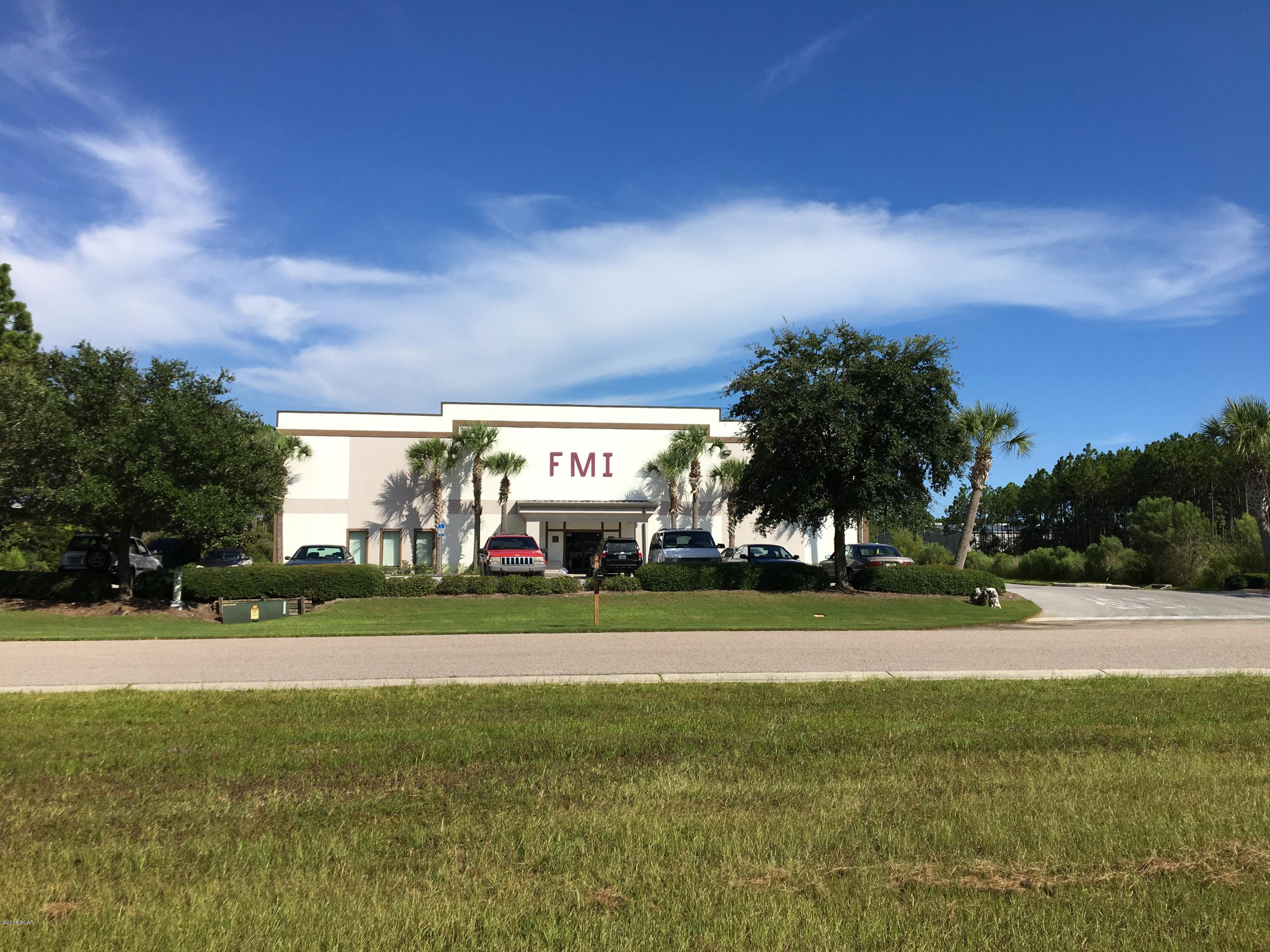 Fantastic Opportunity to own a 31,000 SF building on almost 5 acres of land in Beach Commerce Park, the only industrial park on Panama City Beach, near all of the growth in South Walton and Panama City Beach and less than 10 miles to the Panama City Beach Airport and about 7 miles to the 30-a / South Walton corridor.  Sale comes with approximately two acres of vacant land for yard area or additional buildings. This property is unique in location, size and with the right user could be a heck of a long term investment with upside. Property is being sold with the vacant lot