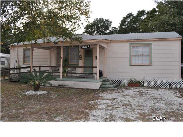 Just one block from the bay and Lake Huntington is where you'll find this charming St. Andrews home. This home has hardwood flooring in most rooms and a spacious kitchen and dining area. The backyard is partially fenced and includes a storage shed, and there is a handicap ramp that leads to the front porch. The location is superb; not only are you close to the water, you're also just 5 minutes from the main street in St. Andrews and downtown Panama City. All info is approx. and must be verified by Buyers if important.