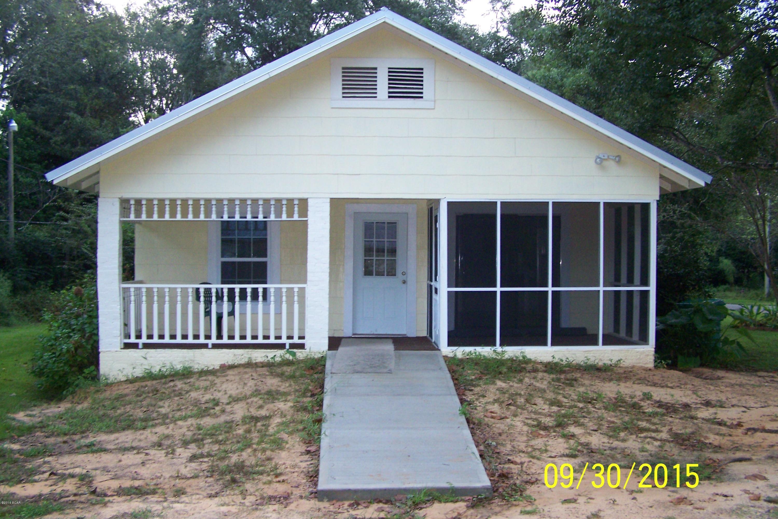 Nicely Renovated 2/1 home located in Alford. Completely renovated home with new metal roof, new insulation in floors, walls and ceilings, new windows, laminate and ceramic tile flooring throughout, 9' ceilings with new beams, 12 centers, sheet rock walls, new bathroom toilet, shower and tub unit, 2 vanities, utility room inside with washer and dryer hookups, and handicap accessibility. Sits on cozy corner lot. Very spacious with living room & den. Open and screened in front porch with plenty of shade. All on paved street & close to shopping. 45 minutes to Panama City.