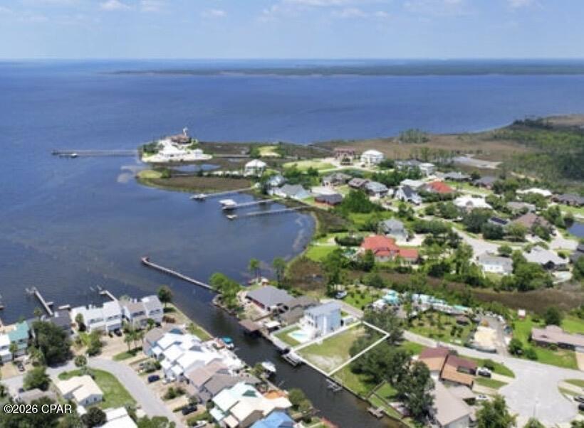 ***50 FEET OF PRIME WATERFRONT IN HIGHLY DESIRABLE AND RARELY AVAILABLE VENETIAN VILLA...WITH A BOAT LIFT AND SEAWALL ALREADY IN PLACE!!*** It is rare to find a waterfront lot in this exclusive and highly desirable community, so hurry up and call me before this beauty gets away!! You are but a few feet from the open bay, and less than a half hour boat ride out to the Gulf of Mexico/America...call it what you will :-) Lot has been cleared and home plans can be provided if you are interested. All information is approximate and should be verified by buyers if important.