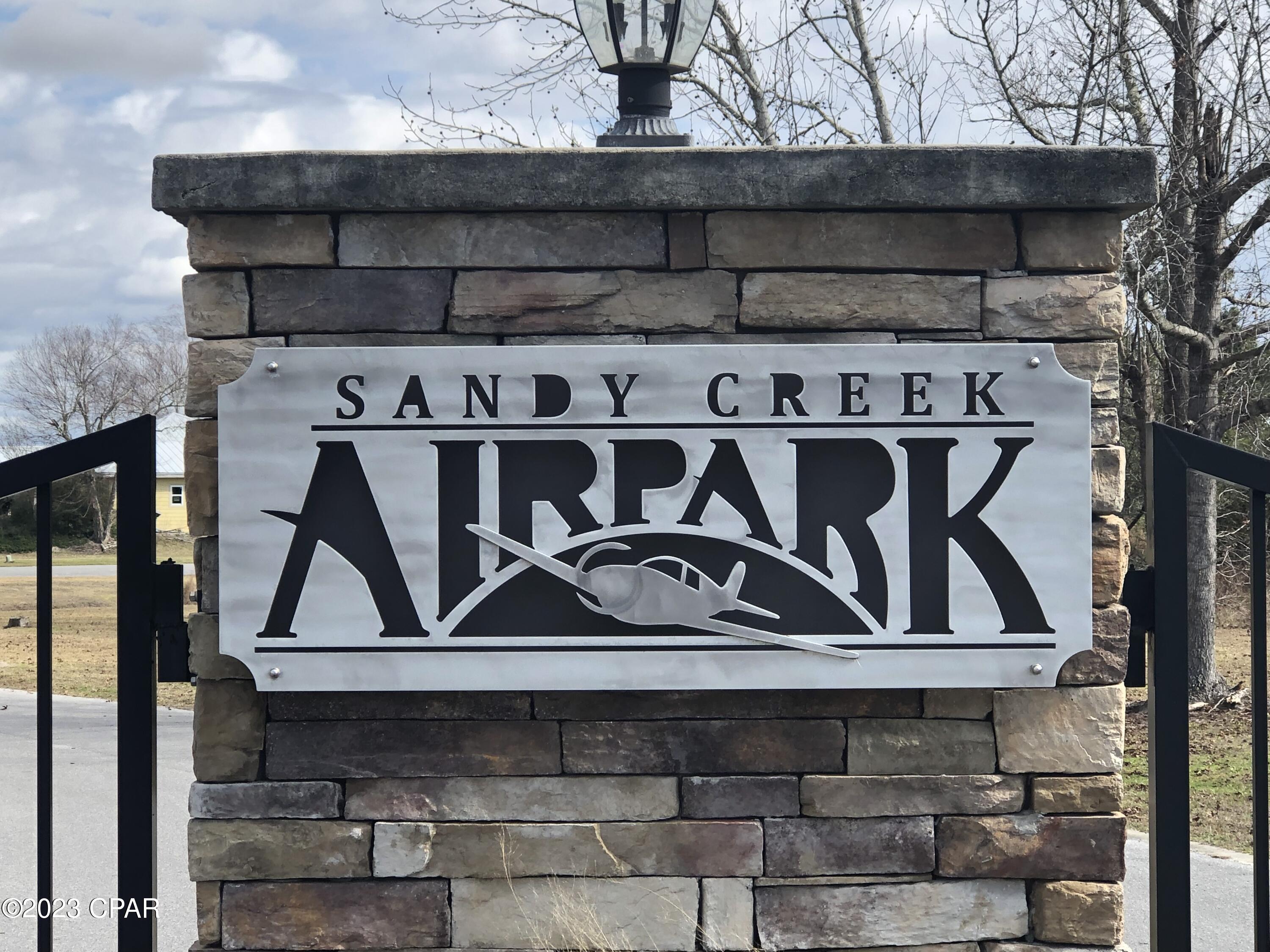 Welcome to Sandy Creek Airpark! A gated residential airpark community that features a 3,200 ft. paved runway, with lights and a beacon for night operations. The large cleared lots are big enough to build your custom dream home with a private hangar. This runway lot features direct taxiway access to the runway. The very low HOA dues maintain the common areas(runway, roads, taxiways and easements). The FAA airport designator is 75FL located on the New Orleans sectional chart.  Don't miss this opportunity. This is a gated community. Please contact the listing agent to see property.