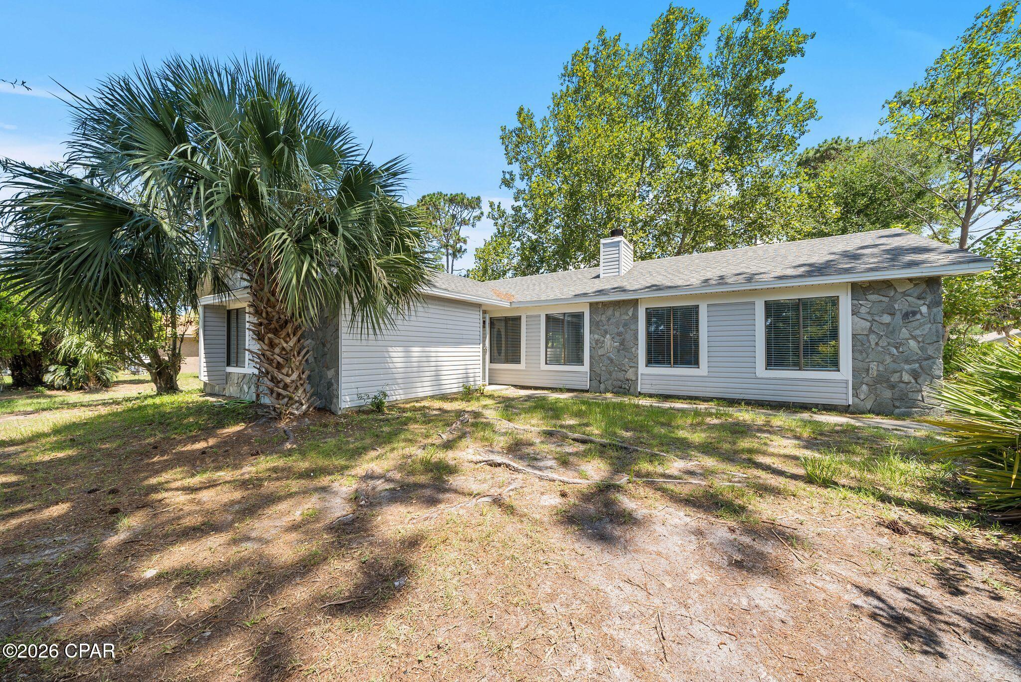 Large corner lot! Great location in the desirable beach community of Treasure Palms featuring all new flooring throughout, beautifully updated bathrooms and bedrooms, 2 car attached garage, wood burning fireplace, and large fenced in back yard with healthy trees providing plenty of shade and privacy. This home is move in ready, make it your own with your finishing touches. Call today for your private tour!