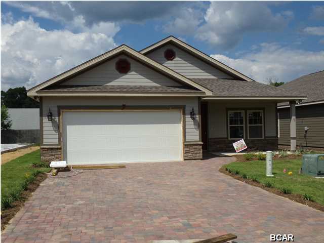 New Construction at Hidden Ridge! SELLER WILL PAY $5000 TOWARDS CLOSING COSTS!! Hidden Ridge is a New 21 Home, Secluded Subdivision in Lynn Haven off Hwy 390. Hidden Ridge has Underground Utilities, Paver Driveways, Sidewalks and Decorative Street Lights. This beautiful New Construction Home features 9/10 Foot Ceilings, 20 inch Porcelain Tile Flooring throughout Main Living Area and Bathrooms. The Kitchen has All Wood Cabinets, Granite Counter Tops with under Mount Sink, Breakfast Island and Whirlpool or Maytag Stainless Appliances. Some of the Standard Features include: Tremendous Master Walk-In ''Step Down'' Showers with 2 Shower Heads, 8ft Interior Doors, Crown Molding, Paver Driveways, Upgraded Carpet and Pad, 14 SEER Heat Pumps, Anderson LOW E Double Paned Windows, Radiant Barrier