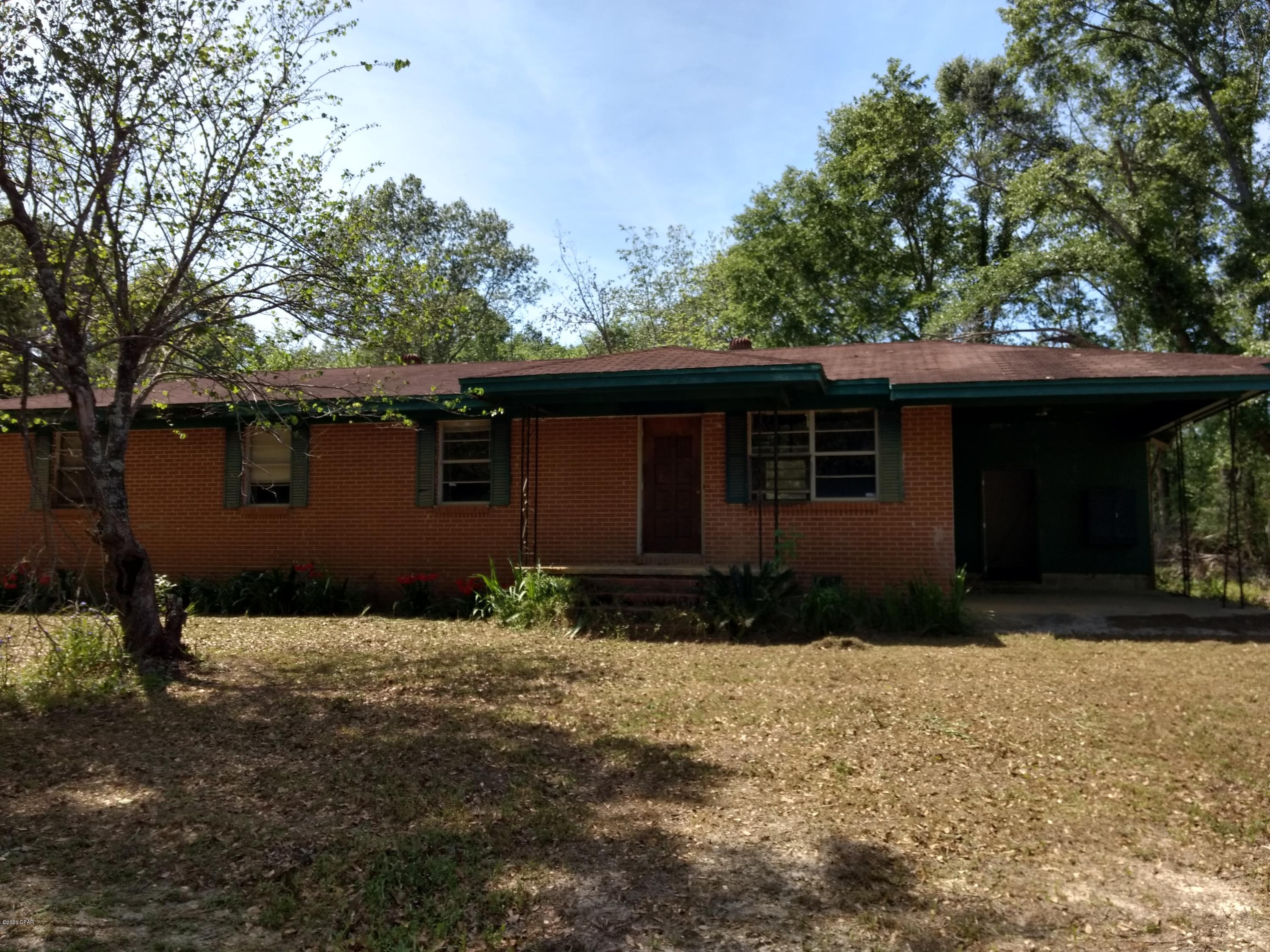 Handyman special, 4 bedroom 2 bath brick home on over 5 acres. Home has some roof damage over the storage room/ garage area. Would make a great family home or possibly rental house with repairs. Property is all high and dry, with some nice shade trees. At this price, it won't last long. Make an appointment to see today
