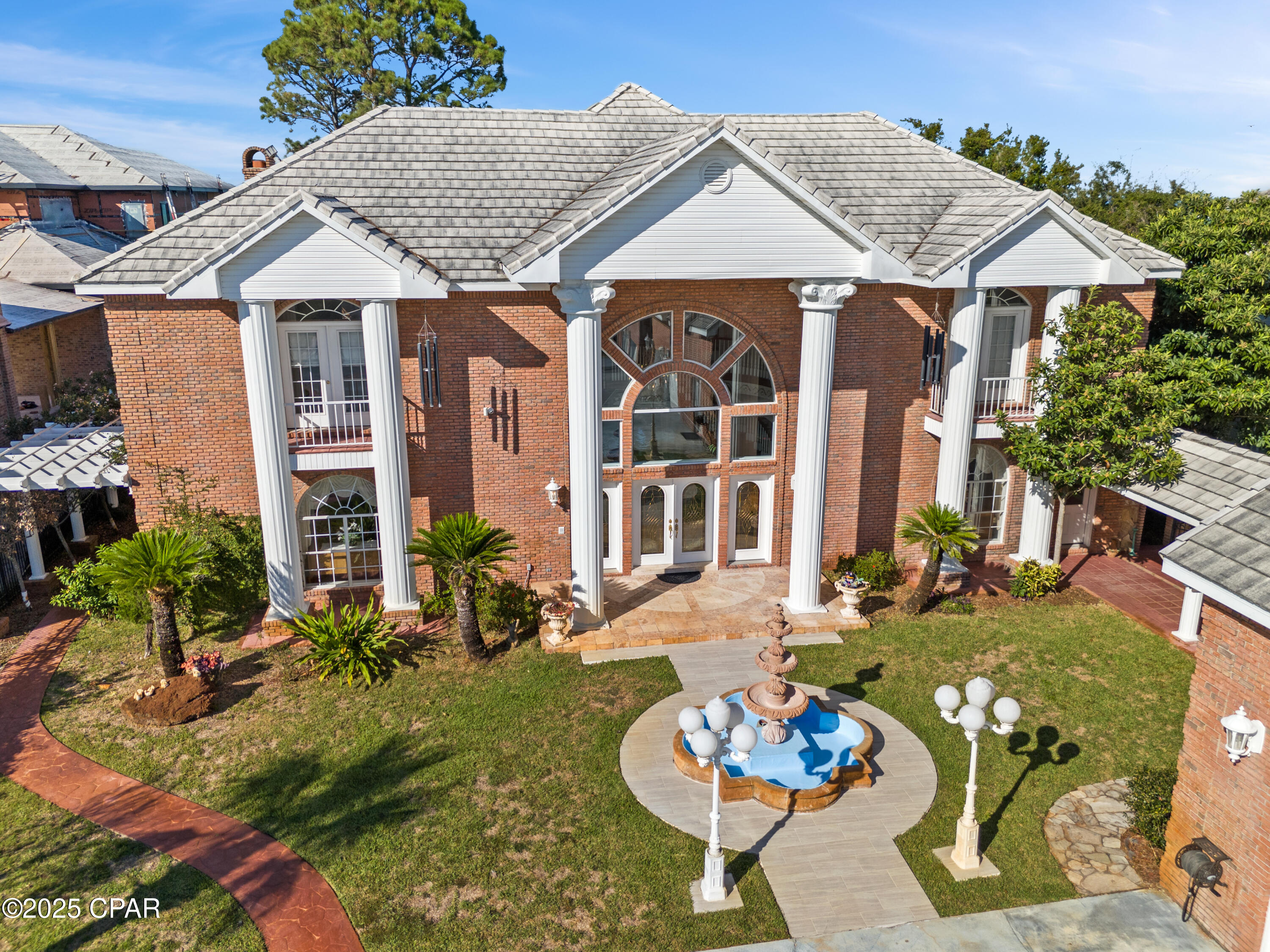 ***OWNER FINANCING OFFERED: 40% TO 50% DOWN, 6.5% FIXED RATE, 30 YEAR AMORTIZATION, 5 YEAR BALLOON*** Hundreds of thousands of dollars in antiques and upgrades were carefully sourced from Antique Auctions hosted by ''The Great Gatsby'' in Atlanta and antique dealers from around the world. This 5 bedroom, 7 bathroom 8400+ square foot bay front villa estate(with a separate fully functional guest home)has so many luxurious finishes it's impossible to list them all...but I'll do my best!! Pontoon boat has less than 15 hours of use and comes with the sale. Upon entering this gated estate you are greeted with immaculate grounds, gardens, and courtyards with breathtaking mosaic fountains, marble statues, hand painted pottery, a marble gazebo, and beautiful marble benches. Columns greet you as you walk up to the home, and once inside you are greeted by 2 exquisite curved staircases, each accented by hand carved wood and under the grandest coffered ceiling with stained glass and Italian marble floors you have EVER seen. The ground floor master suite leaves nothing to be desired with a sitting area that features floor to ceiling glass to take in the breathtaking bay views. The master bath features include a jetted soaking tub, steam shower, oversized vanity, all encompassed in imported hand chosen marble. The formal living room features a grand piano and gas fireplace and leads into the chef's kitchen that offers an oversized island, custom cabinetry, and a fireplace that could easily be converted into a pizza oven! Adjacent to the kitchen is an additional sunlit interior full bar and summer kitchen with a high end grilling area(and original Wyland glass built in picture window valued at $10,000) that looks out into the enclosed heated atrium style pool and hot tub that were built into a covered brick alcove with arches, a bridge, jacuzzi and balconies, all overlooking the bay. The second floor offers 2 oversized bedroom suites with their own en-suite bathrooms, as well as a billiards room and den with a bar imported from England that rivals any exclusive private membership club. The coffered ceilings and woodwork rival any European castle or estate. A spiral staircase leads to a serene third floor sitting room perfect to get away from it all, with more breathtaking views of the bay for you to enjoy either inside or from the private balcony. Above the 4 car climate controlled garage you find the oversized guest cottage that offers a large living area/bedroom, additional bedroom with tongue and groove cathedral ceilings, a small kitchen, dedicated pantry, and 2 full bathrooms. Most of the windows in the home have been replaced in the last 2 years. Stepping out into the backyard of this incredible estate you will find intricate landscaping, marble gazebos, swings, a koy pond, and landscape lighting all leading to 107 feet of seawall protected waterfront. The private dock includes a covered boat lift, 2 jet ski lifts, canoe launch, and a second story rooftop sundeck that is guaranteed to provide stunning bay views and breathtaking sunsets. In total you have 7 fountains, 8 A/C units(2 are newer) and the most marble and detailed crown molding that you will ever see in a home of this size. With too many features to list, this estate/villa has it all and  needs to be seen to be truly appreciated. All furniture is negotiable. All information is approximate and should be verified by buyers if important.