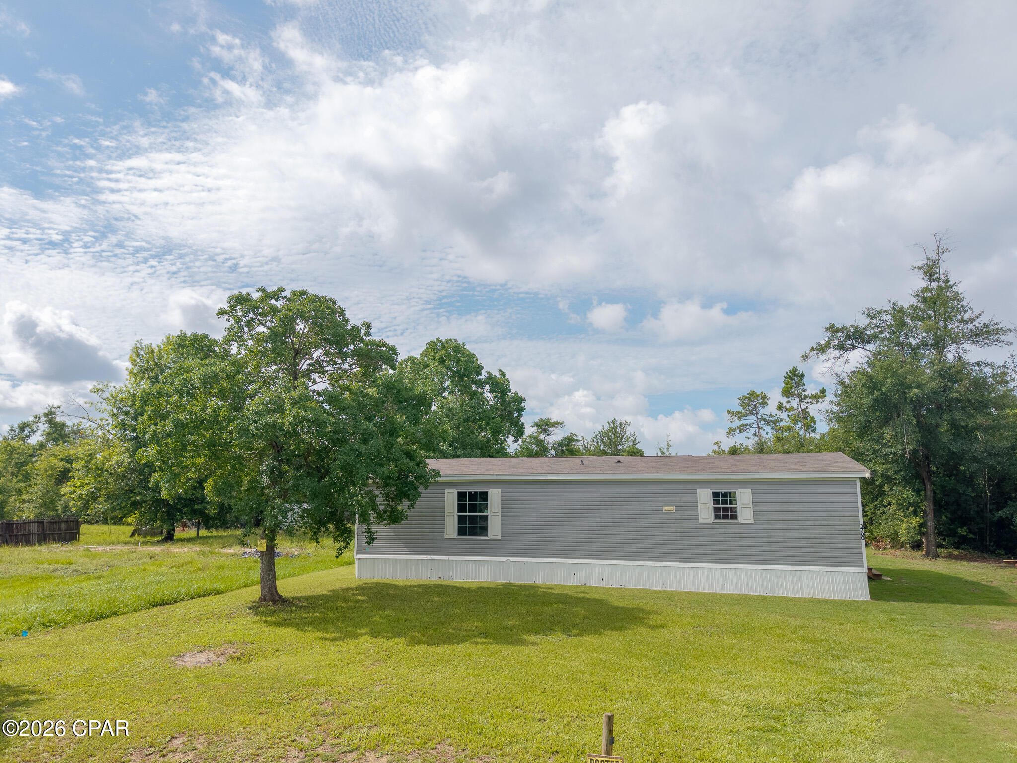 Country Living Near the Water!

Have you been dreaming of a fish camp getaway or a home that's close to everything while still offering the peace and quiet of country living? This beautiful 3-bedroom, 2-bath home, built in 2022, could be exactly what you've been looking for!

Located less than 2 miles from beautiful Deer Point Lake, you'll have easy access to some of the area's best freshwater fishing, boating, and outdoor recreation. Prefer saltwater adventures? The Gulf waters and boat launches are just a short drive away, giving you the best of both worlds.

Enjoy the convenience of being close to Panama City while escaping the hustle and bustle of town. Plus, you're only a short drive from some of Florida's most beautiful white-sand beaches, making weekend getaways easy and enjoyable.

Whether you're looking for a full-time residence, a weekend retreat, or the perfect place to store your boat and enjoy the outdoor lifestyle, this property offers the ideal combination of comfort, location, and convenience.

Don't miss your opportunity to own a nearly new home in a peaceful setting that's close to fishing, boating, beaches, shopping, dining, and everything the Florida Panhandle has to offer!
