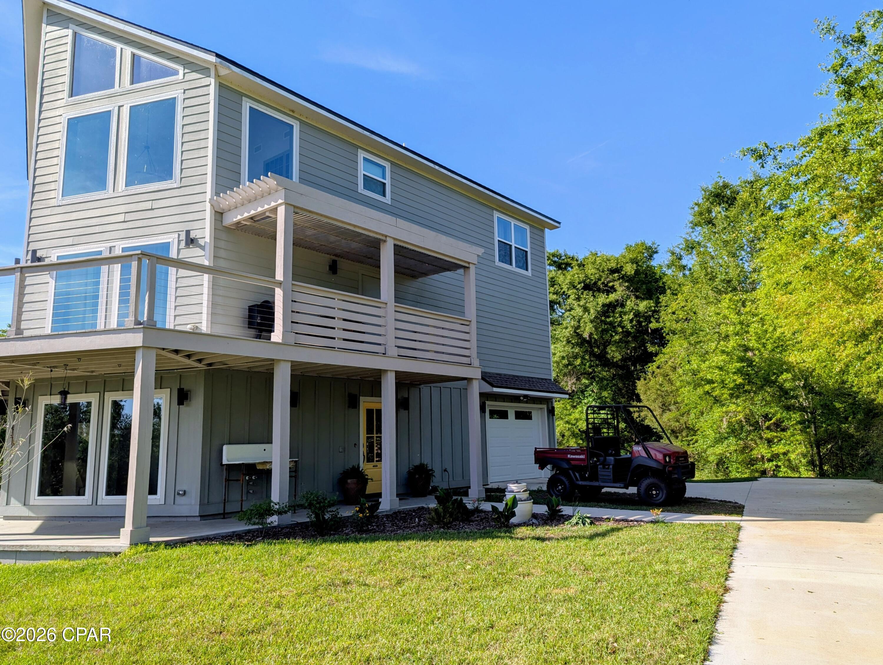 REDUCED -- $10,000. -- REDUCED AGAIN --$20,000--PANORAMIC VIEWS OF MERRITT'S MILL POND + flexible modern living in a 2023 custom build. Situated on a private 1.24 acre lot at the end of a quiet dead-end road. This thoughtfully designed three-story home offers a rare combination of privacy, functionality, and outdoor living.  Inside you will find 4 BEDROOMS, 3 FULL BATHS, and  TWO DEDICATED OFFICES with elevated views  -- ideal for remote work, creative space, or dual home offices.
The first-floor guest suite features a private entrance and a space for future kitchenette ( plumbing and wiring already in place), making for multi-generational living, extended guests, or potential rental use. 
Built for efficiency and comfort, the home includes spray foam insulation,  Low-E windows, and three separate HVAC systems (1 per Level)
The main living area showcases custom cabinetry and woodwork, granite countertop, and an oversize kitchen island designed for both everyday living and entertainment.
Step outside for over 1200 square feet of covered deck and patio space, ideal for relaxing, entertaining, and enjoying the peaceful surroundings.
Located just one mile from the public boat ramp, offering easy access to boating, kayaking, and one of the areas most desirable spring-fed waterways.
This is a RARE opportunity to own a nearly new, move-in ready home with space, flexibility, and views -- without the wait of new construction.
       CLICK ON PHOTO TO SEE MORE.
CALL FOR YOUR APPOINTMENT TODAY -- to see this        Immaculate home !