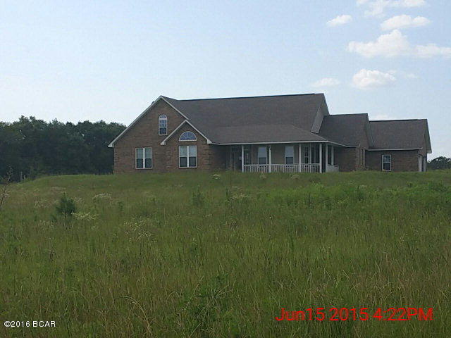 Beautiful brick home in a country setting with 5.1 Acres. Home was built in 2009 and has 2239 square feet. Three bedrooms with three full baths and an additional loft over the garage. Nice custom cabinets in the kitchen with plenty of storage space and nice dining room with a bay window. Huge living room with ceramic tile floors and raised ceilings. Master bedroom and bathroom suite is spacious and has a large walk-in closet. Master bathroom has garden tub,separate shower, and double vanities. 2-Car Attached Garage with loft space above. There is also a kids playhouse in the back yard. 5.1 Acres is cleared and plenty of room for animals or a garden. Come out and see this beautiful home today !!