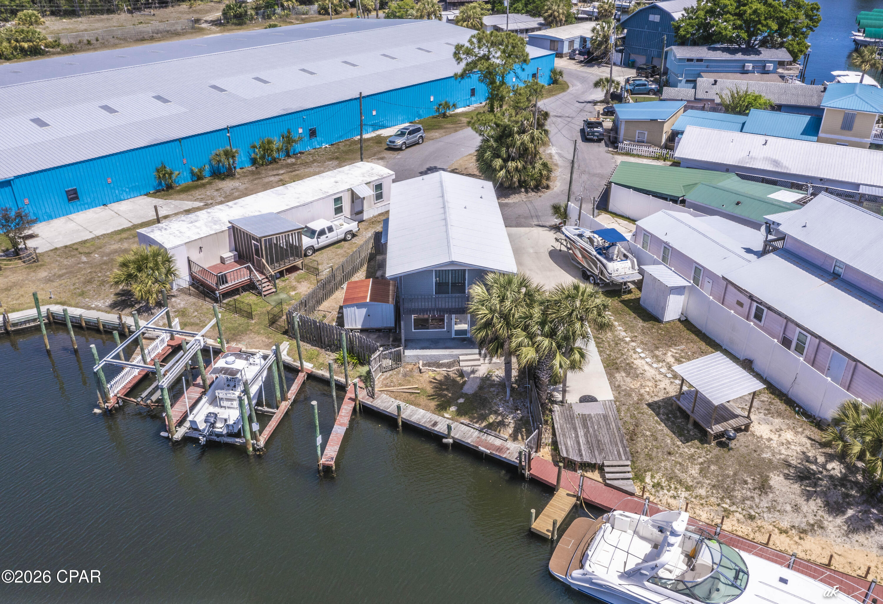 Welcome to 929 Marina Drive!  Waterfront like this is a boaters dream and hard to find on Panama City Beach. Located at 929 Marina Drive, this 3-bedroom property sits on deep water with two private boat slips, giving you direct, reliable access whenever you want to be on the water. Whether it's early morning fishing runs, sunset cruises, or pulling up after a day at Shell Island, this is built for true boat living--not just the idea of it. The home offers waterfront balcony views and room to expand, making it flexible for a primary residence, second home, or a high-performing short-term rental. That's where this one separates itself--short-term rentals are allowed, and very few properties offer private boat slips with that flexibility, a combination that drives strong demand and premium rental potential. You're also positioned exactly where you want to be, about 15 minutes to Pier Park for dining, shopping, and nightlife, around 10 minutes to Schooners and St. Andrews State Park for some of the best beach days on the Gulf, and with quick access into Panama City for everyday convenience. There's also a marina just one minute away with a boat ramp, making launching, storing, or hosting guests with boats simple. This is the kind of property buyers wait on--secure your boat, enjoy true waterfront living, and generate income when you're not using it.