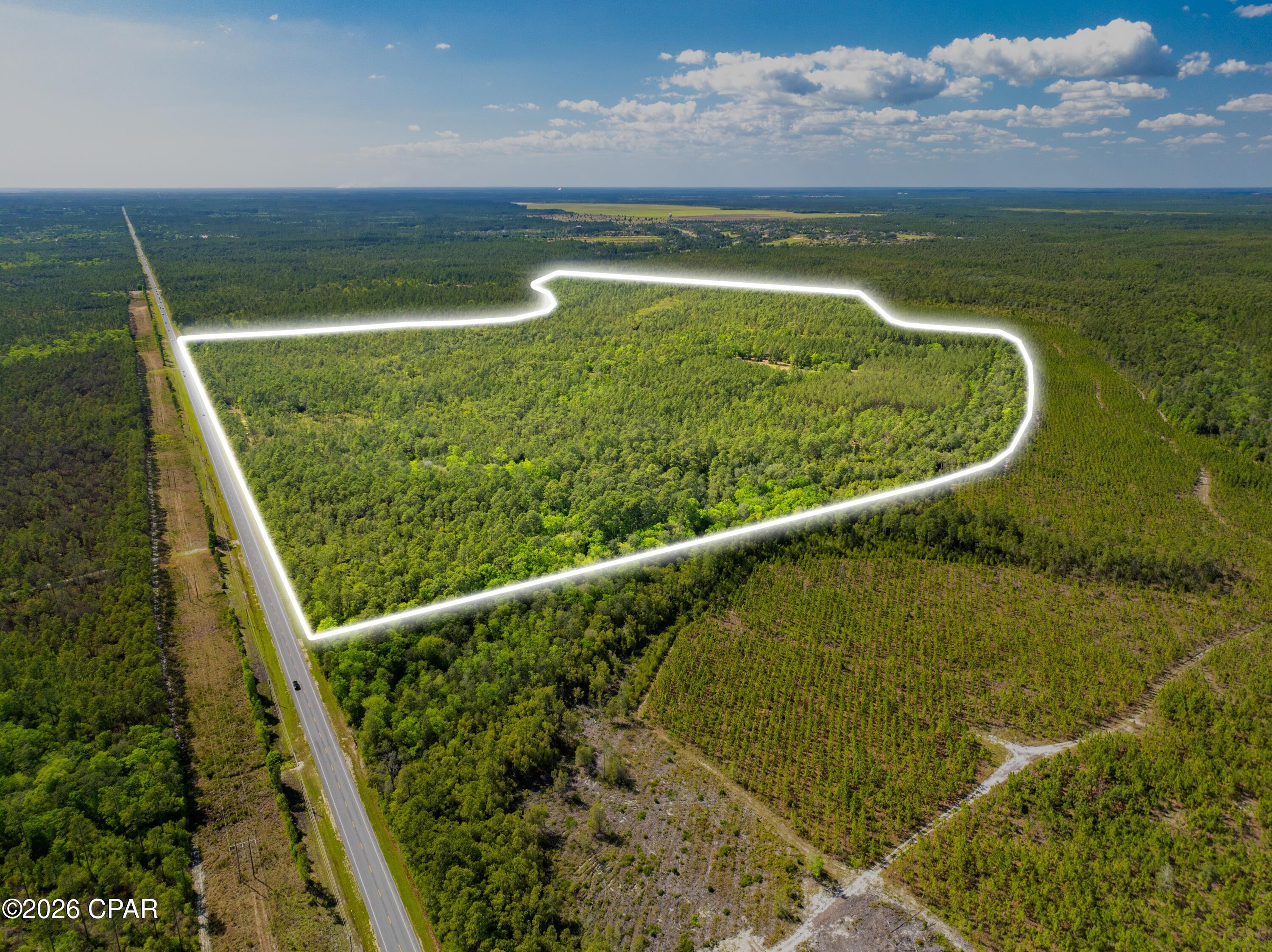 Positioned in the heart of Freeport, one of the fastest-growing communities in all of Florida, this expansive 222-acre parcel presents a rare and highly versatile investment opportunity in Walton County. Designated with a Future Land Use: Rural Residential and Zoning: Rural Village, the property offers exceptional flexibility for investors and developers alike. Whether envisioned as a large private estate, phased residential community, or a strategic subdivision and resale opportunity, the possibilities here are both diverse and scalable. The parcel is ideally located just 6 miles from U.S. Route 331, providing convenient access south to the world-renowned beaches of Scenic Highway 30A, which are only 20 minutes away. The property is also located just 20 minutes from Latitude ... Margaritaville and just under 30 minutes from the Panama City Beach Airport. The Airport is currently undergoing a large expansion, positioning it to become a principal port of entry into the area. The new Florida State University affiliate Hospital and Clinics, currently under construction, will also only be an easy 20 minutes drive. This prime positioning places future residents within easy reach of coastal amenities while enjoying the privacy and space of a rural setting. The parcel is the site of the proposed "Quail Run" residential development, envisioned to include approximately 400 homesites along with two 40,000-square-foot commercial buildings, creating a thoughtfully designed mixed-use community. Surrounded by the continued growth and demand driving Freeport and the greater Emerald Coast region, this property stands as a prime opportunity to capitalize on Northwest Florida's upward trajectory. With substantial acreage, favorable zoning, and subdivision plans already drawn up, this offering is well-positioned for immediate and long-term development success.