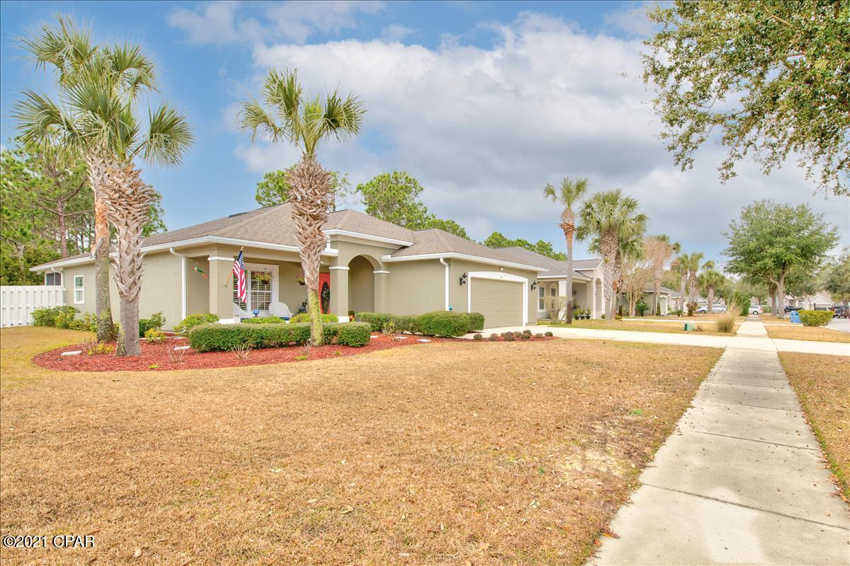 CURRENTLY UNDER CONTRACT, SELLER ACCEPTING BACKUP OFFERS. This well maintained home has it all.  Exterior was recently painted, and inside is just as clean. Kitchen offers granite counter tops, and stainless appliances.  There's lots of crown molding, plantations shutters, and a central vac system. Common area flooring is beautiful 9/16'' thick engineered hardwood.  Open the French doors to a bonus room, perfect for an office or play room. Master bath has a whirlpool tub, separate shower, and double vanity. Home sits on a corner lot, has a fenced back yard, and includes a 10x10 shed and hurricane shutters.  Seller has put roll down blinds in the screened in room, as well as non slip ''Gator Grip'' on the floor. Situated in the very desirable Palmetto Trace, this home is just 2 minutes to