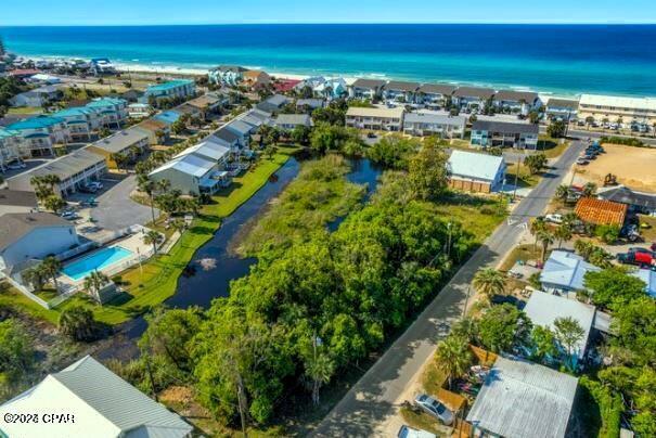 🌅 Waterfront Luxury Meets Beach Life | Build 3-4 Homes in Laguna Beach 🏖️Secure your slice of paradise on this rare waterfront lot where coastal living meets smart investing! 📈 Situated on a serene pond just steps from the Gulf, this property is perfectly primed for your primary residence, a guest cottage, small compound of homes, a lucrative short-term rental. With R2 Zoning these lots are allowed up to 2 homes each. ✨💎 The Highlights:🙅♂️ No Red Tape: Located in the coveted X FEMA Flood Zone! Build without the headache of extra permits, elevation studies, or high-cost flood insurance.🏡 R2 Zoning: Maximum flexibility to build two standalone homes or a main house with private guest quarters each lot.📍 Prime Location: A short, scenic stroll (~850 feet) to the crystal-clear emerald waters and white sandy beaches of Laguna Dedicated Beach! 🌊🌴 The Lifestyle:🍩 Local Icons: Walk to your favorites like the famous Thomas Donuts and the Carousel! 🎢🚙 Golf-Cart Friendly: Embrace the relaxed, 'beach-minded' culture of this vibrant golf-cart-centric neighborhood. 💨💼 Investor Approved: Vacation and short-term rentals are fully allowed for maximum ROI. Don't miss this rare chance to live in the sea air and build exactly what you've envisioned. Make your offer today! 🔑🦅 BEST PRICE LOTS IN THE WEST END.