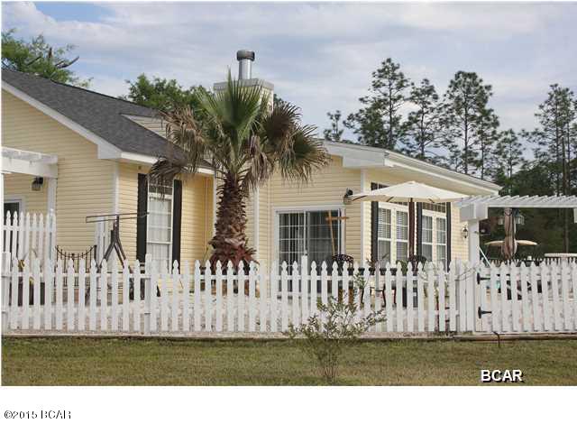 JUST REDUCED!! Beautiful Cottage home, You must see this one. This home has a beautiful country setting, yet not to far from the beaches. Inside this home looks like a magazine and has been very well cared for. This home has 10ft ceilings, crown molding, archways and  planters walls. The kitchen is open to the living room and dining area, and boasts a large island. There's also a office space off the living area. This beautiful cottage has engineered hardwood floors. The laundry room has a craft area with a counter area and glass blocks and is located off from the kitchen. Outside the French Doors from the master bedroom is your very own private pool. This cottage has a white picket fence around the pool, also there's a pergola at the front door. Large yard. This is a MUST see home