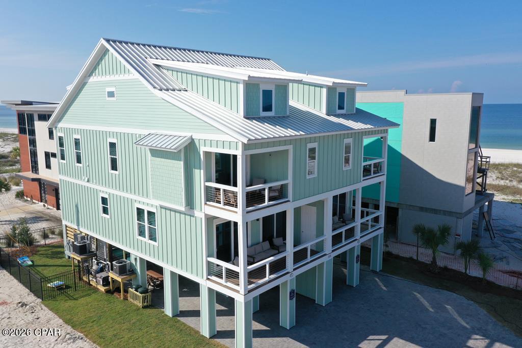 Investment Opportunity!  Established Rental Income! Rent ready gem, luxury duplex, fully furnished & equipped to attract vacationers looking for a memorable stay in Mexico Beach. Total of 12 en-suite bedrooms, along with two half baths and two bunk rooms, the property can comfortably host large groups, making it a lucrative investment in Florida's thriving rental market. This stunning luxury duplex in Mexico Beach, FL, is more than just a home; it's a gateway to creating unforgettable memories with family and friends. With its prime location, luxurious amenities, and versatile living options, it stands out as an exceptional opportunity for anyone seeking a slice of paradise. Whether you envision it as your dream home, a vacation getaway, or a profitable investment, this property is ready to welcome you to the best of beachside living. Each Side - Level 1: The first level greets you with a spacious foyer & a convenient half bath, setting the tone for the elegance that follows. Level 2: Ascend to the second level, where you'll find a spacious living-dining-kitchen area adorned with designer furniture. The gourmet kitchen features granite countertops, stainless steel appliances, a stylish backsplash, and exquisite wood cabinets, along with a charming farm sink. This level also includes a cozy bedroom with an en-suite bath, a powder room, & a laundry area. A covered porch provides stunning views of the beach and is the perfect spot for sunset watching. Level 3: On the third level, three additional bedrooms with en-suite baths ensure privacy and comfort for family members or guests. A covered porch offers a private escape to catch the refreshing Gulf breeze, making this level a perfect retreat after a day of beach fun. Level 4: Family Fun Zone The fourth level is dedicated to recreation, featuring a family area perfect for kids, along with two more bedrooms. One of these bedrooms is a fun haven, equipped with three sets of twin bunk. Enjoy the heated cocktail pool, a putting green & covered patio.