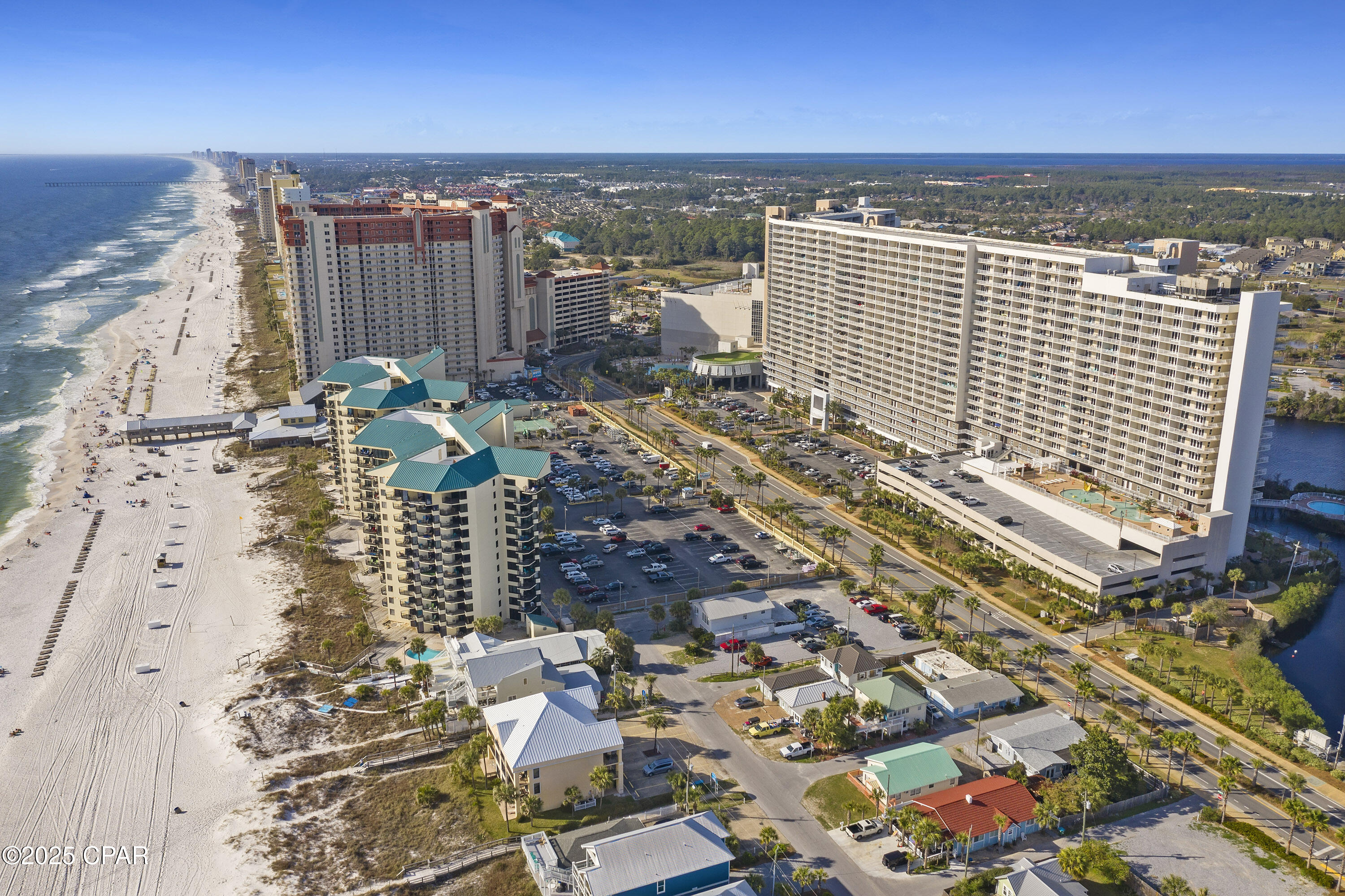 This low-floor, end unit gem is a beautifully furnished 3-bedroom, 3-bath plus bunk area end unit in Laketown Wharf, perfectly located in the heart of Panama City Beach. This spacious third-floor condo offers sleeping accommodations for up to 10 guests and features a wraparound balcony with peaceful lake views. The coastal BoHo décor along with the completely upgraded lighting throughout creates a bright, inviting atmosphere ideal for relaxing by the beach or entertaining family and friends.

The layout includes two generous master suites with balcony access, a private bunk area with window and closet, and a guest bedroom that shares a full bath. The kitchen opens to a large living and dining area, creating a comfortable gathering space.

Laketown Wharf offers some of the best amenities on the beach, including five pools, two hot tubs, a fitness center, putting green, nightly fountain light show, on-site dining and shopping, and private beach access just across the street. This location also provides easy access to Walmart, Pineapple Willy's, and other popular attractions.

With strong vacation rental potential and a location just steps from the Gulf, Laketown Wharf 301 is perfect as a second home, income property, or full-time residence. Schedule your showing today and experience the best of coastal living in PCB.