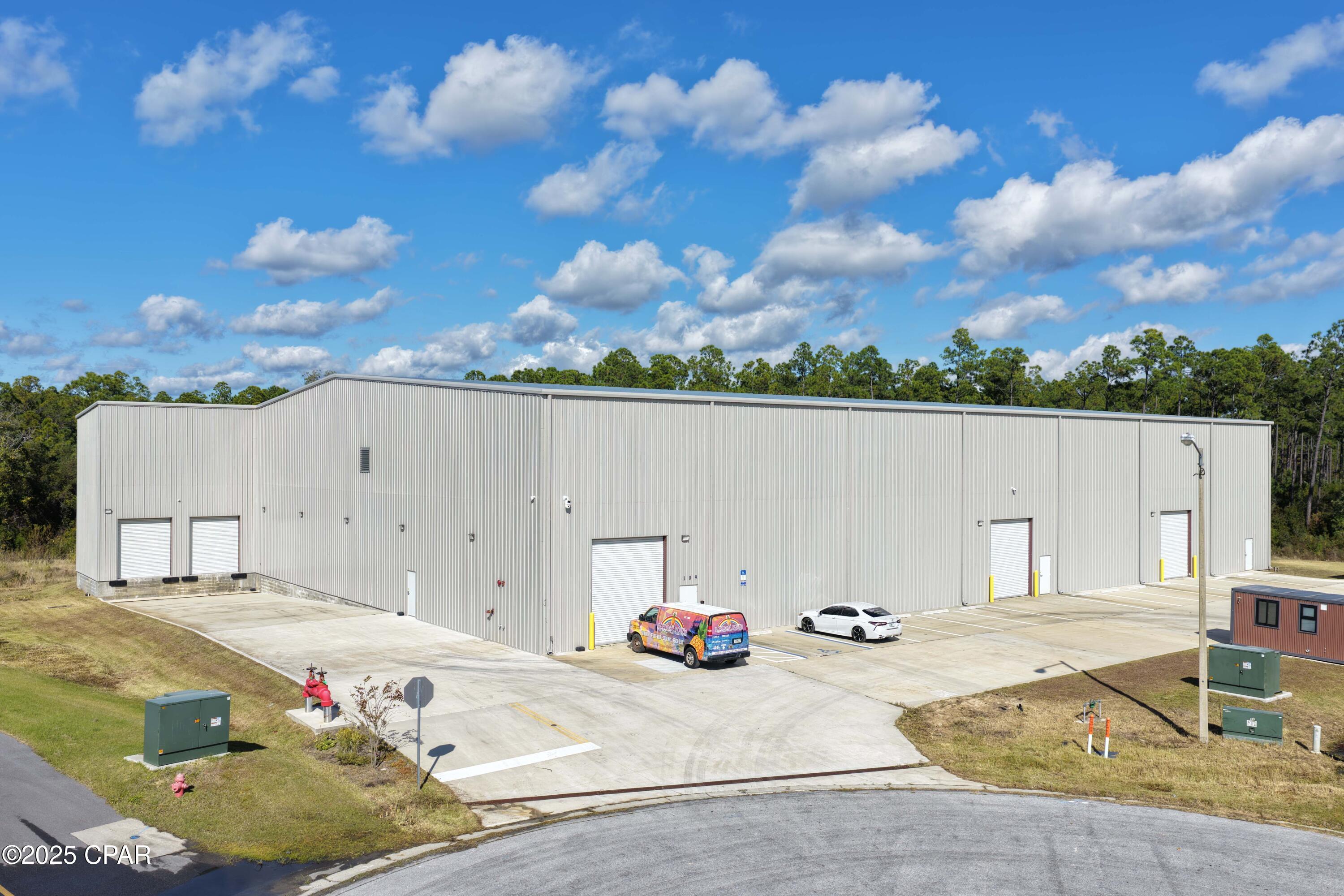 Rare opportunity to acquire a truly unique, industrial warehouse, tallest in the county adding ex located within Beach Commerce Park in Panama City Beach, Florida. Offered at $6,590,000, this owner-occupied facility can be vacated at closing, making it ideal for an owner-user or investor seeking an irreplaceable industrial asset.
What sets this property apart is its extraordinary clear height, measuring approximately 48 feet at the center of the building and approximately 41 feet at the lowest point, far exceeding standard warehouse heights in the surrounding market. Typical industrial buildings in the area range from 18-24 feet clear, with newer construction rarely exceeding 30-32 feet. This dramatic vertical advantage creates exponentially more usable storage volume, allowing for high stacking, specialized racking systems, and operational efficiencies that simply are not possible in conventional warehouses.
The building features a large clear-span layout, steel-frame construction, concrete slab foundation, metal panel exterior, and multiple overhead roll-up doors to support logistics, distribution, storage, or light industrial use. The property is situated within an established industrial park with excellent access and circulation, making it suitable for a wide range of warehouse users seeking scale, flexibility, and long-term functionality.
This is a one-of-a-kind warehouse offering for the Panama City Beach market, replacement cost and zoning constraints make replicating this building height extremely unlikely.
Buyer to verify all dimensions and specifications.