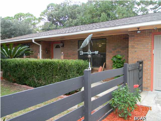 REDUCED! This quality brick ranch is RENOVATED & MOVE-IN READY WITH TONS of new upgrades!! NO FLOOD ZONE - NO HOA FEES - private neighborhood deeded lagoon access to fish, canoe, kayak. Public boat ramp just across the lagoon! All fenced with double gate & room for your boat, RV and pets! Triple parking! Quiet street, mature hardwoods. Open floor plan has NEW ROOF, GUTTERS & PAINT, NEW engineered hardwood floors throughout, NEW travertine floors in bathrooms, NEW ceiling fans & 2'' wood blinds in all rooms, NEW paint, NEW KENMORE stainless refrigerator & dishwasher - NEW electronic security system & NEW garage door. Bonus room could be an office/playroom/hobby room or 4th bedroom. Nice screened in back porch w/room for Jacuzzi! Wonderful large yard fenced w/cypress, magnolia & fruit trees. Customized 2 CAR GARAGE IS ALSO HEATED & COOLED - great MAN CAVE!! NO HOMEOWNERS ASSN FEES