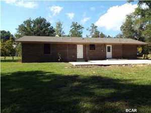 REDUCED!!! Brick Ranch on almost two acres with new paint, carpet, and appliances offered as is. The house seems larger than it really is with an enclosed one car garage as a another bedroom and a separate room for the washer and dryer. The lot cleared to road. All sizes are approximate please verify accordingly.