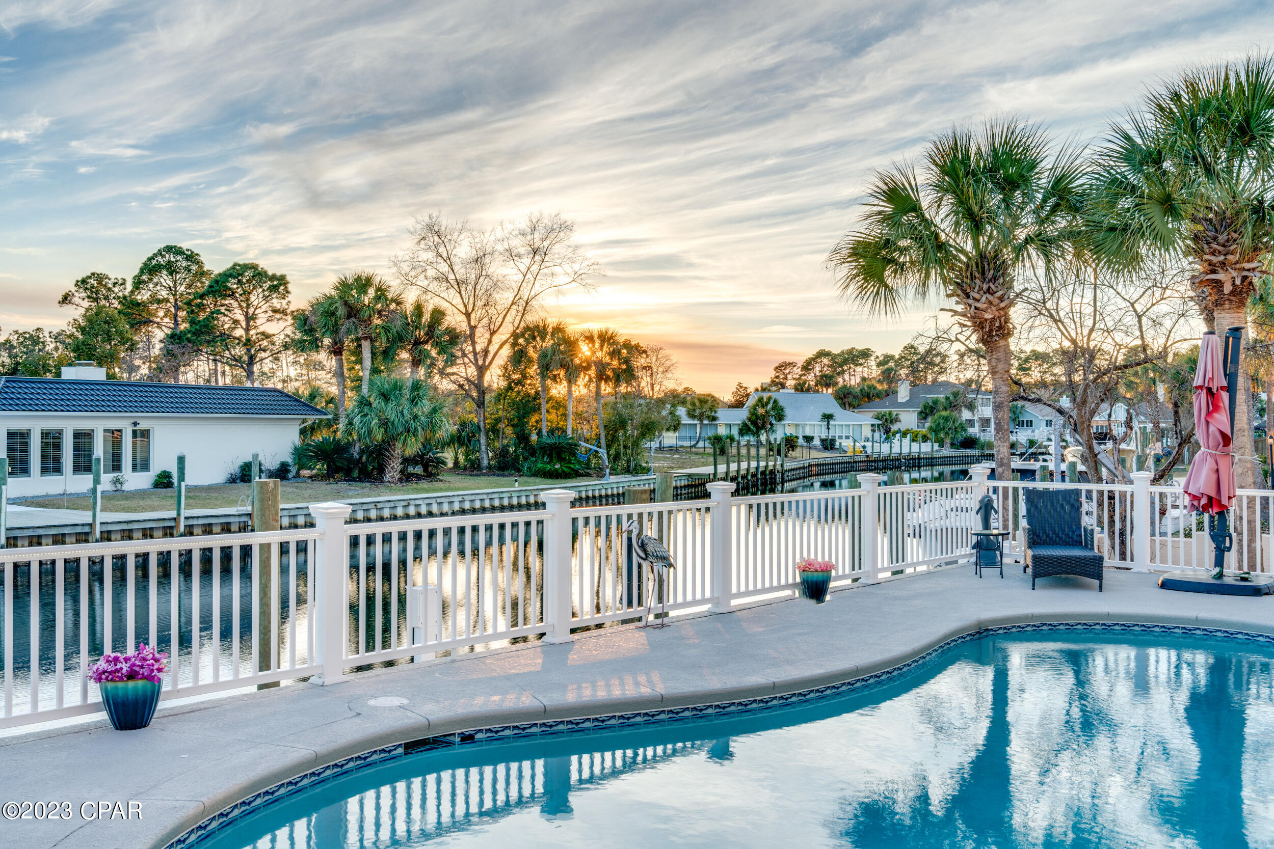 CURRENTLY UNDER CONTRACT, SELLER WILL CONSIDER BACKUP OFFERS **WATERFRONT IN GATED BAY POINT** This beautiful 4 bed, 4.5 bath canal front home is heavily upgraded, including a stunning updated kitchen, spacious living area, and a private pool, making it a fantastic place for entertaining both inside and out. Enjoy a short boat ride to open water or play 18 holes at the Nicklaus Golf course. The Bay Point Yacht Club is also in the neighborhood along with the Serenity Spa. Featuring an impressive kitchen, game room, Florida room, outdoor bar, outdoor shower and plenty of parking for guests, this beautiful home is certainly one to see. All bedrooms have their own bathrooms and there is even room to park the golf cart in the garage.