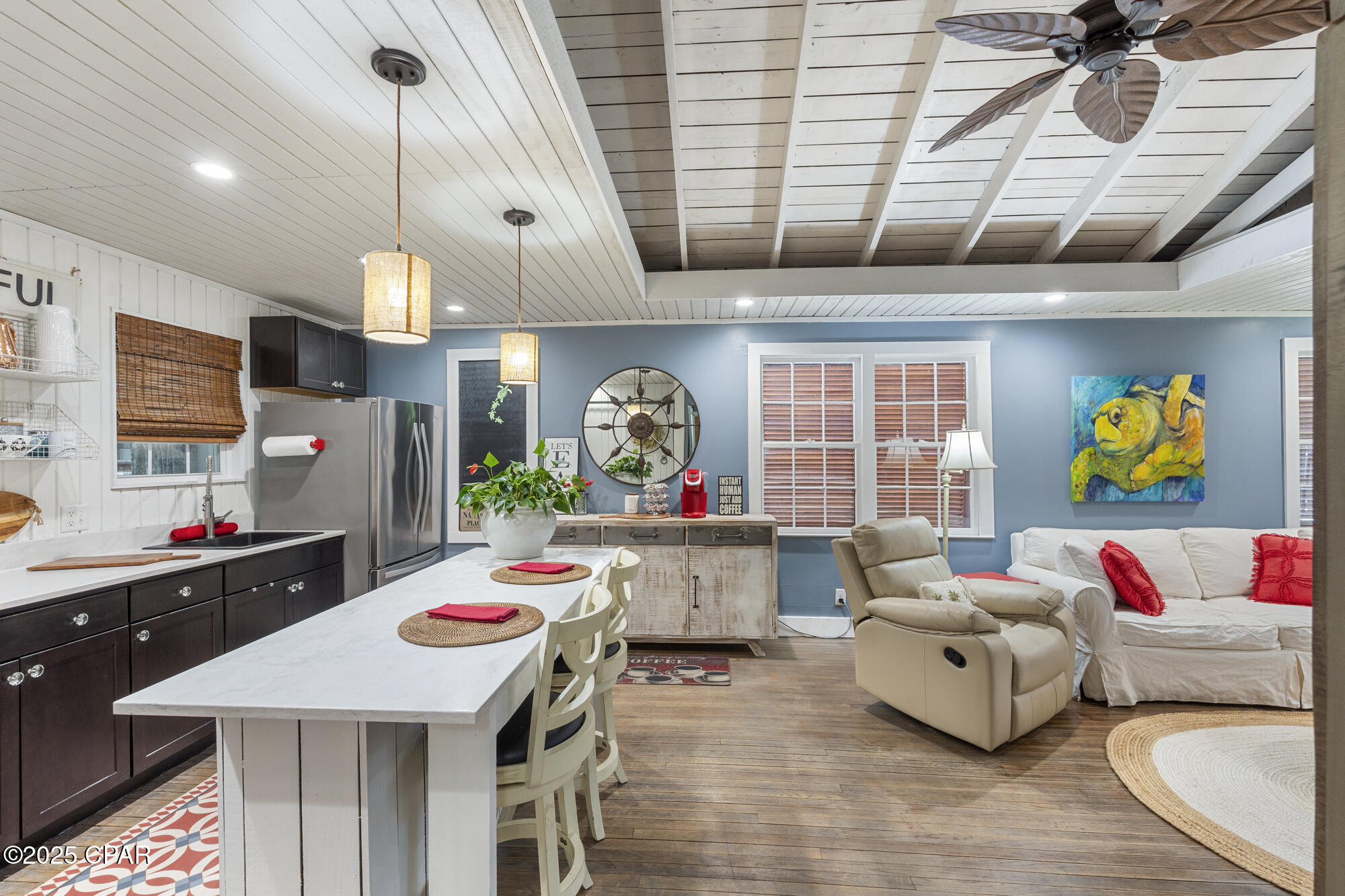 Welcome to this beautifully renovated 3-bedroom home on a spacious corner lot in the heart of Historic St. Andrews! Perfectly located within walking distance to the Bay, St. Andrews Marina, Shrimp Boat, Captain's Table, Uncle Ernie's, restaurants, shopping, and entertainment.

This home blends historic charm with modern updates. Inside, you'll find freshly painted walls (2023), updated flooring, and an original built-in bookcase that dates back to the captain's quarters of salt boats. 

The kitchen features stainless steel Whirlpool appliances, and a farm-style sliding door leads to the laundry nook with a 2025 stackable washer/dryer and water heater. The HVAC system (new in 2018) is located in the attic and has been serviced twice a year. Both the plumbing (to the street) and the electrical system have been completely redone, giving peace of mind for years to come.

The exterior of the property offers a large fenced backyard and carport, along with two 10×20 sheds, both equipped with full electrical. One is a classic saltbox-style shed, while the other is insulated and features AC, a half bath, lofts, and a mini refrigerator—perfect for guest space, a home office, or even rental potential. The lot is beautifully landscaped with jasmine, crape myrtles, and monkey grass, adding to the charm of this historic St. Andrews home.

The perfect blend of beach house charm and backyard oasis living—this home is coastal living at its finest. The history, location, and upgrades make this a truly special opportunity in St. Andrews.