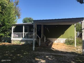 Very nice renovated home off North Lagoon in a quiet neighborhood on cul-de-sac. 14x66 ft. custom home with plenty of extras. New metal roof, vinyl plank flooring and dishwasher.  Oak cabinets with lots of storage and pull out drawers.  Extended screened porch features roll down shades with extended patio.  Great back yard with orange and gardenia trees and two utility buildings.  Stand alone bunkhouse has wall window air unit, insulated and sleeps five. Septic tank recently cleaned.