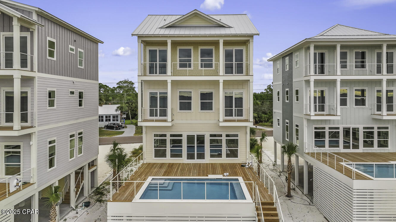 ULTIMATE GULF FRONT HOME! Nestled on pristine Gulf front sand, 273 Watermark Way offers the ultimate coastal escape-where turquoise waves, sugar-white beaches & unforgettable sunsets set the stage for lifetime memories. This brand-new custom beachfront build, within the serene lower-density stretch of St. Joe Beach, effortlessly combines luxury, comfort & coastal charm. With six beautifully appointed suites, this home is perfect for multi-family vacations or large groups seeking space, style & shared experiences. Each beachfront king suite opens onto its own deck, allowing you to drift awake to sea breezes and Gulf views. The homes best feature is a private heated pool just steps out the door to be enjoyed year round. The soaring open living spaces, gourmet kitchen & soft coastal finishes evoke easy elegance. The layout is designed for joyful mingling where you enjoy panoramic Gulf vistas from every level & wide decks that connect you to the horizon. An elevator provides smooth access across all floors. Beyond the walls of this spectacular home, you'll find immediate access to the Gulf with a private boardwalk & steps to powdery sand. Hop in your golf cart or go for a peaceful bike ride along the paved paths to Windmark Beach where you will find fun, food, and entertainment for the whole family.     A short ride into Port St Joe connects you with  boutique shopping, fresh seafood restaurants, a bustling marina, and a charming historic district. Whether you're planning an epic family retreat, a generational reunion, or a carefree getaway with friends, this home is built to host in style. From sunrise yoga to cocktail hour on the deck, to late-night stargazing by the sea—every moment unfolds with elegance and ease. Call for your private tour & LIVE THE BEACH LIFE!