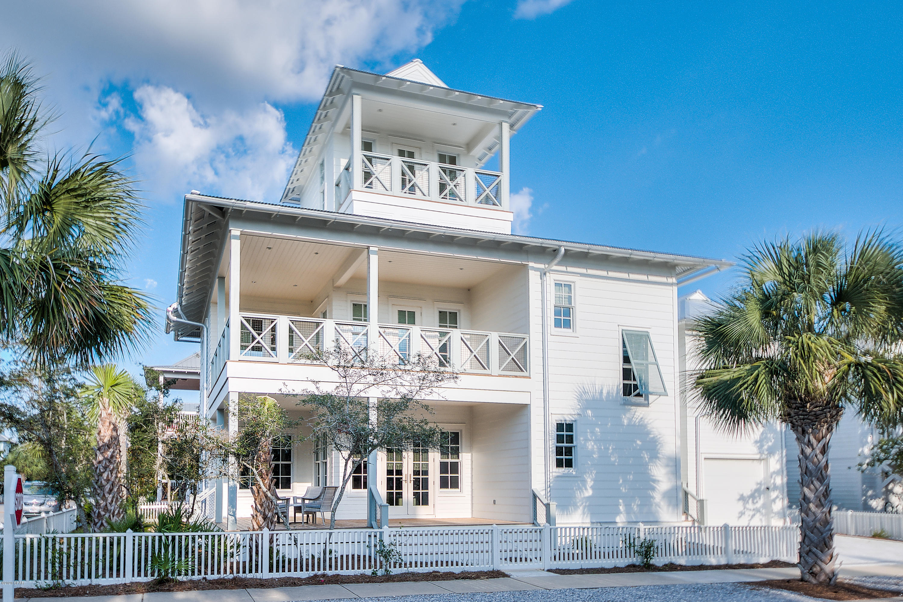 Beautiful three story home features 3 bedrooms and a bunk room that will accommodate up to twelve guests in the gated community of Carillon Beach located on the Gulf of Mexico. The open floor plan on first floor, which incorporates kitchen dining and living room, offers the perfect setting for family gatherings after spending a day on the sugar white sand beaches and turquoise waters. The gourmet chef's kitchen is complete with commercial style appliances and highlighted by a honed marble island with bar stools. The second floor consists of 2 master suites, an additional bedroom and bunk room with 4 beds. Spiral staircase leads you to the bonus room that has gulf views and a deck for watching gorgeous sunsets.