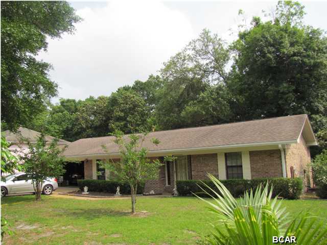 There will be an Estate Sale in progress from 5/28/2015 to 5/30/2015 Large brick home nestled on a great size lot that backs up to Sudduth's Pond. This lovely home features 3 large bedrooms, and 2 full baths. There are 2 living spaces separated by a two way gas fireplace. Eat in kitchen and a formal dining room. In addition to the screen porch there is also a Florida room with access from the kitchen area and the master bedroom. Split bedroom plan. Inside laundry room. In the garage there is a mud room/ could be an office that is air conditioned. The back yard slopes to the pond and the extensive decking would make a great place to entertain guests. The roof was replaced in 2004.