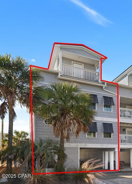 This beautifully updated 4-bedroom, 5.5-bath townhome offers approximately 2,396 square feet of heated living space across four thoughtfully designed levels, blending coastal character with modern comfort and functionality. Originally built in 2003 and extensively updated in 2018, the home features a standing-seam metal roof, solid construction, and quality finishes throughout. The main living level showcases an open-concept design ideal for entertaining, with shiplap accent walls, crown molding, recessed lighting, and durable luxury vinyl plank flooring. A spacious living area flows seamlessly into the chef's kitchen, which features white cabinetry, solid-surface countertops, stainless steel appliances, decorative tile backsplash, and a large center island with bar seating. Pendant lighting and coastal design details extend into the dining area, creating a warm, inviting atmosphere. Each of the four bedrooms includes its own en-suite bath, offering privacy and flexibility for owners and guests. Bedrooms are generously sized and thoughtfully furnished, with ceiling fans, custom touches, and ample natural light. Bathrooms are well appointed with custom vanities, solid-surface or marble-style countertops, contemporary fixtures, and tiled showers. A stylish powder room adds convenience on the main living level. Additional highlights include a dedicated laundry room with shelving, built-in cabinetry, attractive stair detailing, drywall interior walls, central air conditioning with ducted heat, and a functional mix of tile and vinyl plank flooring designed for durability and low maintenance. With approximately 3,830 total square feet, the multi-level layout is ideal for full-time living, second-home use, or rental potential. Well maintained and move-in ready, this coastal townhome delivers space, comfort, and timeless beach-inspired design.