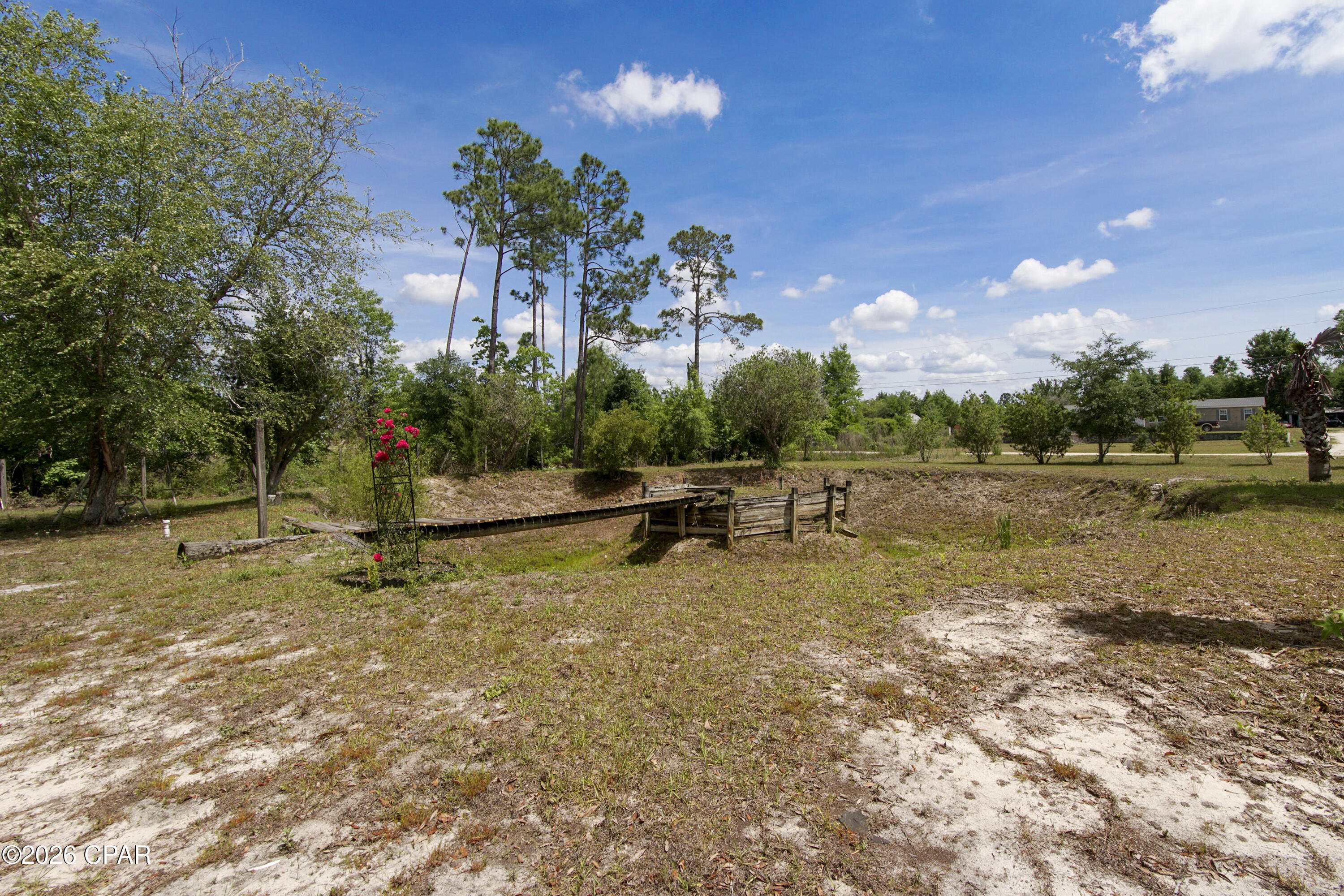 Peaceful and affordable living at this maintained home in Bayou George. With 2 bedrooms and 2 bathrooms the home is comfortable to live in. There is a porch attached with an overhang to sit and enjoy the nature with an attached carport large enough for 2 vehicles. The acre has been meticulously maintained and cleared for enjoyment with a pond area and walkover. There is a shed on the property to use and a beautiful pond out front. New septic and drain field installed after 2019, home is on a deep well system, metal roof installed 2019, vinyl siding, carport and appliances also updated in 2019. recently new floors have been installed and seller is continuing to make improvements on the home. Come enjoy the wildlife come up to your door every day. Just a short drive to the Lake or Springs. Convenient to get to from Campflowers Rd for access. Shown by appointment only.