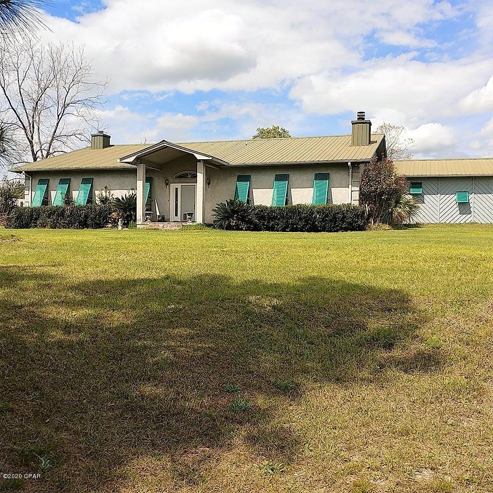 CURRENTLY UNDER CONTRACT, SELLER ACCEPTING BACKUP OFFERS.   Welcome home to your own country estate on 40 high and dry acres with beautiful views !! Recently remodeled 3-bedroom, 2-bath home with 3168 square feet,  a 2-car attached garage, and 3 custom, wood-burning fireplaces.  Open kitchen/dining area with a lot of counter space/cabinets and an island that features a nice cooktop. The dining area has a wood-burning fireplace and double-doors leading to the back, covered patio and the 32'x14' in-ground, fenced, concrete pool with spa - perfect spot for spending time with friends and family. From the kitchen, step down to the huge 26'x24' open Family Room with fireplace. Features a massive master bedroom with beautiful fireplace and a large walk-in closet.  Roomy master bath with custom, walk-in shower. Split-bedroom floor plan. Large mudroom with cabinets and a separate laundry room. Garage doors, well pump, and pool pump are all new.  Outside you will find a huge 6-bay, 2400 square foot barn (100'x24' on slab) with a 12'x24' shelter on the end of barn.  Barn has power and water available.  There is also a Metal Shop/Work Building (50'x30' on slab with 50'x12 shelter on the side) with a nice office space and 1/2 bath set-up inside. The Shop has a separate entrance and mailbox. Property has approximately 20 acres of planted pines and 18 acres of pasture.  So many possibilities and plenty of room to expand.  Make this showplace your own !!