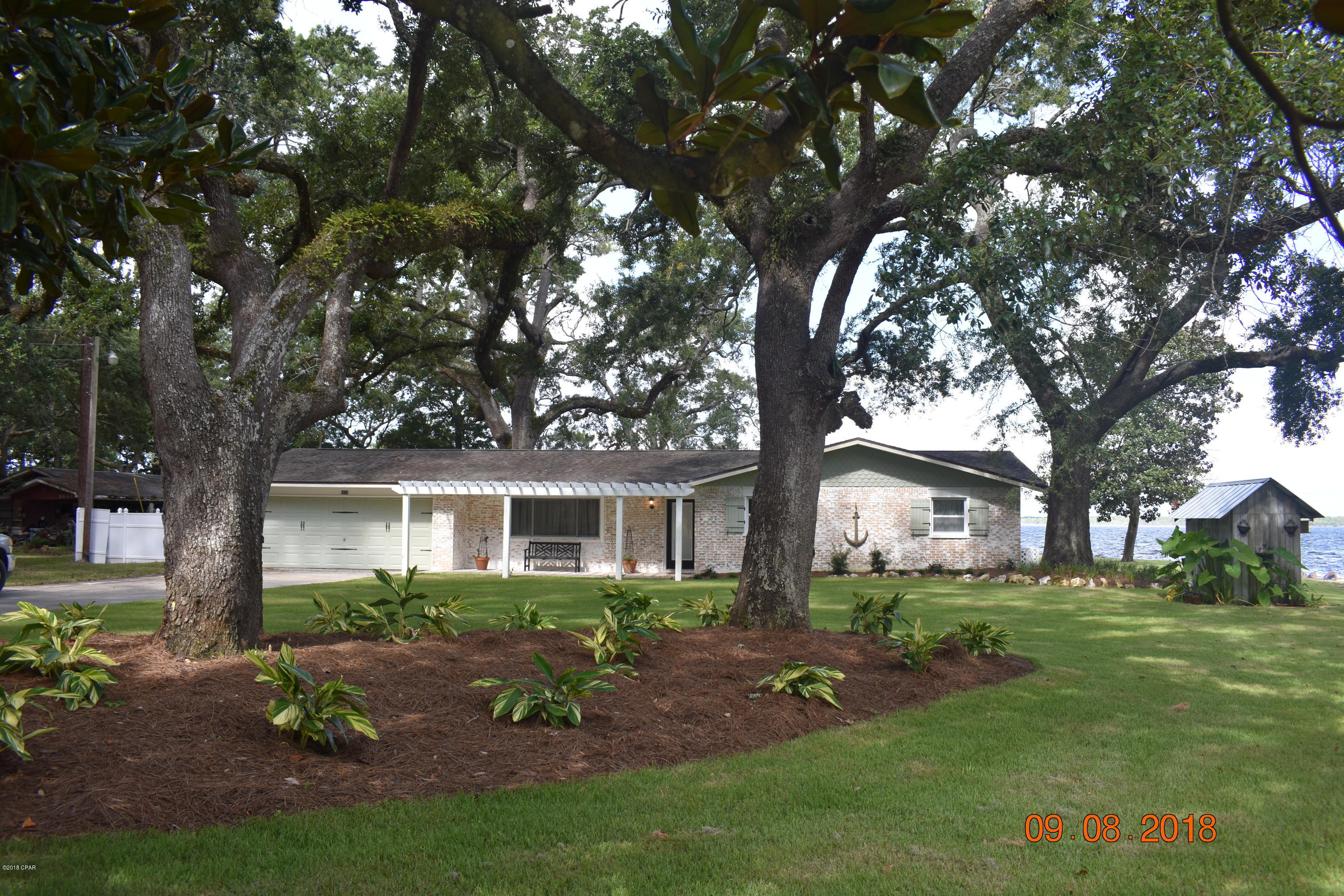 Beautiful Ranch Style home, located on bay in Sandy Creek. Has its own boat ramp. 3 bedrooms, 2 baths. Wood floors. Kitchen has JennAire gas cooktop, double wall oven, french door refrigerator, farm house sink, and butlers pantry. Master bath has separate shower and tub. Features a large copper soaking tub. His and hers sinks. Master Bedroom overlooks the bay. Living room has gas fireplace. Florida Room features ship lap and overlooks bay and walks out to patio. Home is beautifully furnished and can rented with or without the furniture. This home is a must see!

Approval required for pets.  

Home is on well/septic. Includes Culligan. Inside and outside pest control and lawncare included.