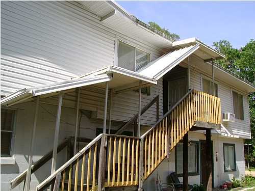 Centrally located home with open floor plan, central heat and air, and close to schools and shopping. Water, sewer, garbage, and yard maintenance included.