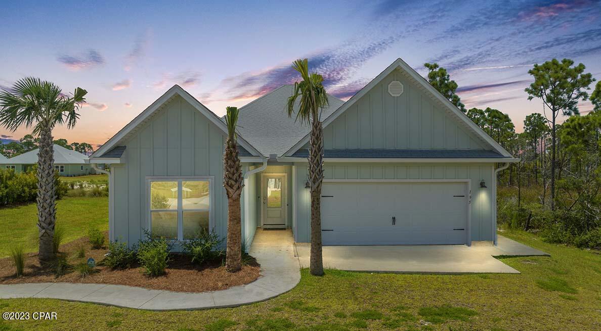 The Kenney is a 4-bedroom, 3-bath home with just under 2,200 square feet of living space located in WindMark Beach *overlooking a pond! *  Unique to the Kennedy is an entire second living space, or mother-in-law suite.  This section includes a separate exterior entrance, separate air handler, separate washer/dryer hookups, and kitchen.  Standard features of this home include beautiful granite countertops with undermount sinks in both kitchens and all bathrooms. Luxury Vinyl Plank flooring throughout the entire home, 9-foot ceilings throughout.  Stainless steel appliances included in both kitchens are a free-standing smooth top range, microwave, and dishwasher.  This home also includes a disposal and water filtration system in the Kitchen.  WindMark Beach is a tranquil community where one can enjoy the natural settings with boardwalks, walking paths, bike trails, and deeded beach access. WindMark Beach also offers residents numerous luxury amenities and features including a community pool, a gym, restaurants, packaging store/bar, beach equipment rentals, community fire pit, local shopping, and a versatile community center.   Images, descriptions, SF and room sizes are approximate.