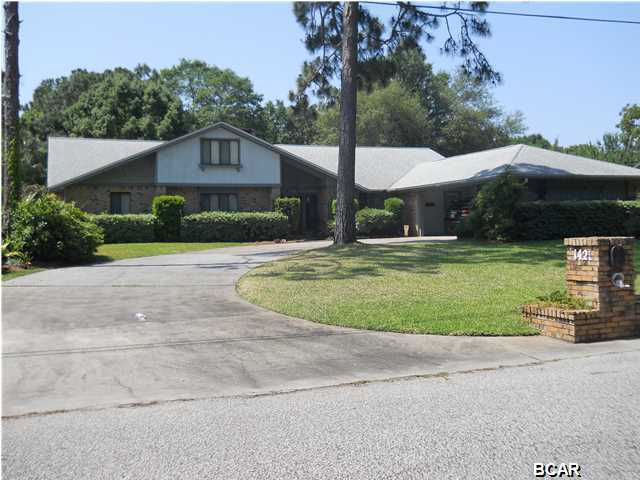 If you need space, this house has it. If you like well maintained inside and out or a very nice yard, this house has it. This 4 bedroom home offer a very open floor plan, split bedroom plan, 2 fireplaces (1 in the master bedroom), plus and upstairs bed, bath and den for the older kid. Roof was replace in the last 6 years, septic has been replaced in the same time frame. Property is located in Lynn Haven but has septic and well. No Water bill! The bedrooms are large, the family room has cathedral ceilings plus a very nice built in wooden bar. The kitchen comes equipped with solid surface counters, and updated appliances. This home is located just minutes from shopping, medical offices, good schools and more.