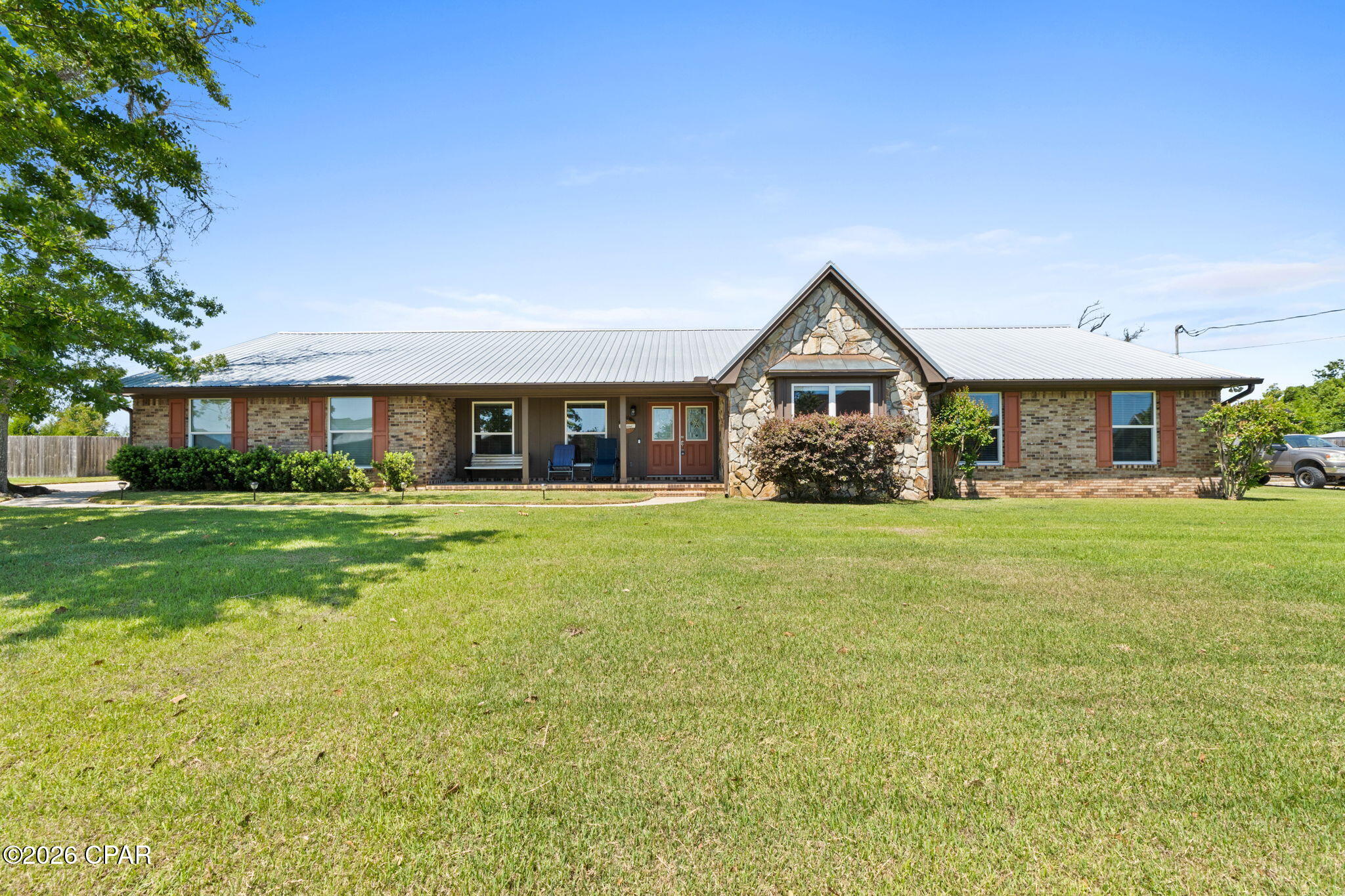 The Open House is Canceled on 4/25. 
Don't miss this beautiful Lynn Haven home in College Point with a sparkling pool.  This 4 bed 2 bath home is generously located on over a half acre and is spacious at 2,765 sf.  You'll love how large the rooms are and how much light is in the home.  You have an office/flex room and a formal dining room at the front of the home and an open kitchen/dining/living space in the back overlooking the inground pool.  There is a wood burning fireplace as a focal point in the home.  Laminate vinyl plank is throughout making it easy to care for.  Other highlights include a beautifully remodeled kitchen with stainless steel Kitchen Aid appliances and quartz countertops, a large laundry/utility room with sink, remodeled master bathroom with tiled shower, large screened porch with bbq grill, garage with pull down attic stairs, large storage closet, sprinkler system, gutters, large front porch, and double gate to backyard.  Metal roof - 2019, Water Heater- 2023, HVAC with air scrubber- 2019, Septic/Drainfield/Sump Pump - 2013, New Well and Pump- 2024, Appliances - 2019, Pool Pump and Sand Filter- 2024.  Termite bond through Brock Pest Control is transferable. Ring cameras located in front, back, side and driveway are hard-wired and will stay. Water softener is owned.  Make plans to see this one today!