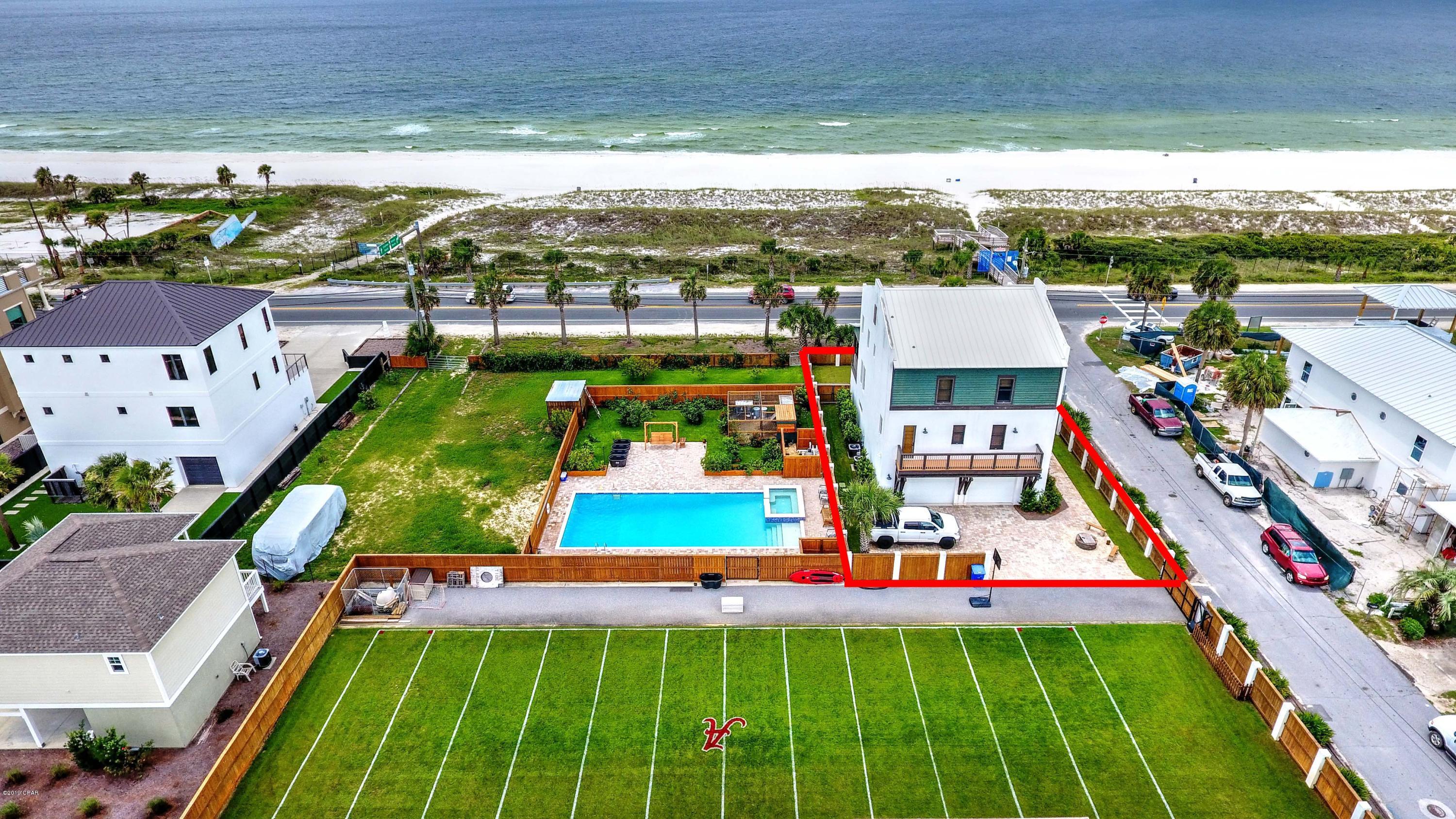 Your private paradise! Fully enclosed and gated for your privacy.  Don't compare apples & oranges; this is a concrete home engineered above hurricane standards. Strength matching elegance, this home is 3-stories of poured concrete block with metal roof & top of the line Andersen storm doors & windows. Enjoy sunset dinners from oversized balconies on the 2nd & 3rd level with ornately stained pine ceilings and wood floors overlooking the Gulf & the only private, dedicated, gated beach in PCB. Gulf views from the full size study and master suite on the third floor and living/dining/kitchen area on the second floor.  Beautifully landscaped yard fully enclosed with 6' stained wood privacy fence and gates, reinforced with beautiful solid concrete columns for extra safety. Oversized, 2-car garage with extra storage space.  5250 square feet under roof including a large storage room, 1 loggia, oversized garages with more storage capacity and 2 Gulf-facing covered balconies.  3150 square feet heated and cooled including bonus room on the first floor. Also available is the 60x100 lot next door with 56,000-gallon saltwater pool with hot tub, outdoor bathroom and garden area with fruit producing fig trees and the fragrance of jasmine growing along the fence.   see MLS# 788475.