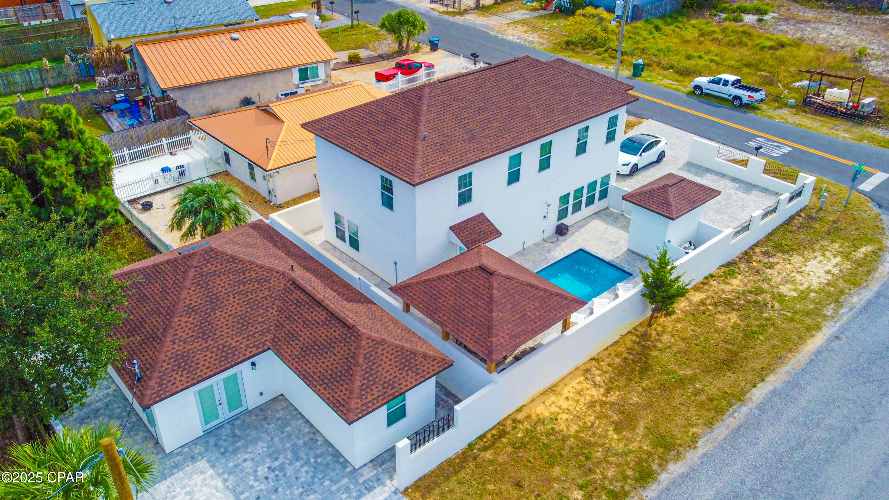 СURRENTLY UNDER CONTRACT, SELLER ACCEPTING BACKUP OFFERS 
Ultimate luxury and privacy await at 6324 Sunset Avenue in Panama City Beach! This stunning estate boasts a fully furnished ready to to go 5-bedroom 3.5 baths main house and a charming 2-bedroom 1 bath guesthouse with its own separate entrances fenced with rarely finded SOLID CONCRETE FENCE and planty of parking space.

Just 0.2 miles or 5minutes walk from the beach, this property is a true retreat right by the ocean.

The main 2story house features 9-foot ceilings, custom accent 30a style walls, walking showers, Solid Oak Hardwood flooring on a second floor with covered balcony perfect for gulf coast breathing ,sunset-sunrise lovers, built-in bunk beds, LVP flooring on a first floor, fully-equipped kitchen with quartz countertop and beautiful livingroom and dining area. While the guesthouse boasts 2 bedrooms with custom accent walls, fully equipped kitchen together with cozy living room.
Enjoy resort-style living with a sparkling pool, built-in grill and gazebo with speakers, perfect for all fresco dining, family or friends gatherings.

With separate entrances, this property offers flexibility for multi-generational families, guests, or rental income potential. Relax by the pool, stroll to the beach, and indulge in the ultimate coastal lifestyle.

With NO HOA FEES this property located in a quite neighborhood closed to the greatest restaurants, beautiful St. Andrews State Park, all beach attractions and only 8miles from the Pier Park!

Perfect for SHORT TERM RENTALS !!
Don't miss out on this rare unique opportunity to own a piece of paradise!!!
Schedule a showing today!