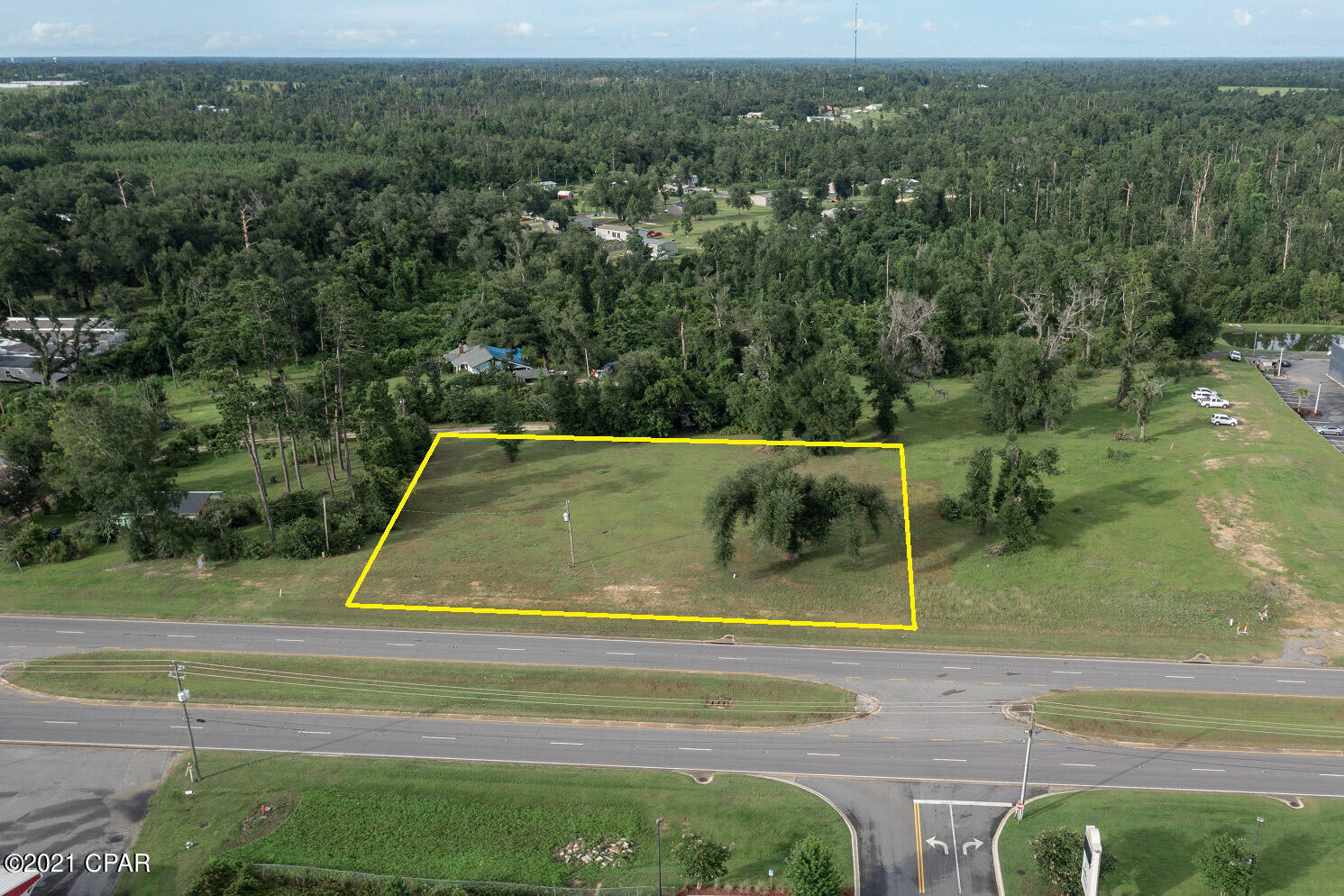 COMMERCIAL LOT located in a very busy business area of Marianna.  Surrounding this Lot is a New Nissan Car Dealership, Strip Mall with full capacity, Older Shopping Center with full capacity including Bealls Outlet, Big Lots, Hibbit Sports, large Family Restaurant and a Medical Office.  Other local businesses are Auto Repair and Tire Stores.  This lot has access to all utilities.  4 Lane Divided Highway with easy access.  Est. DOT Average Daily Traffic 8400.  Local New Housing is across the highway.  Located between the main residential area of Marianna and Interstate 10 including WalMart, Restaurants and Lowes.  This is the Perfect Building Site and it is Cleared and BUILD READY!