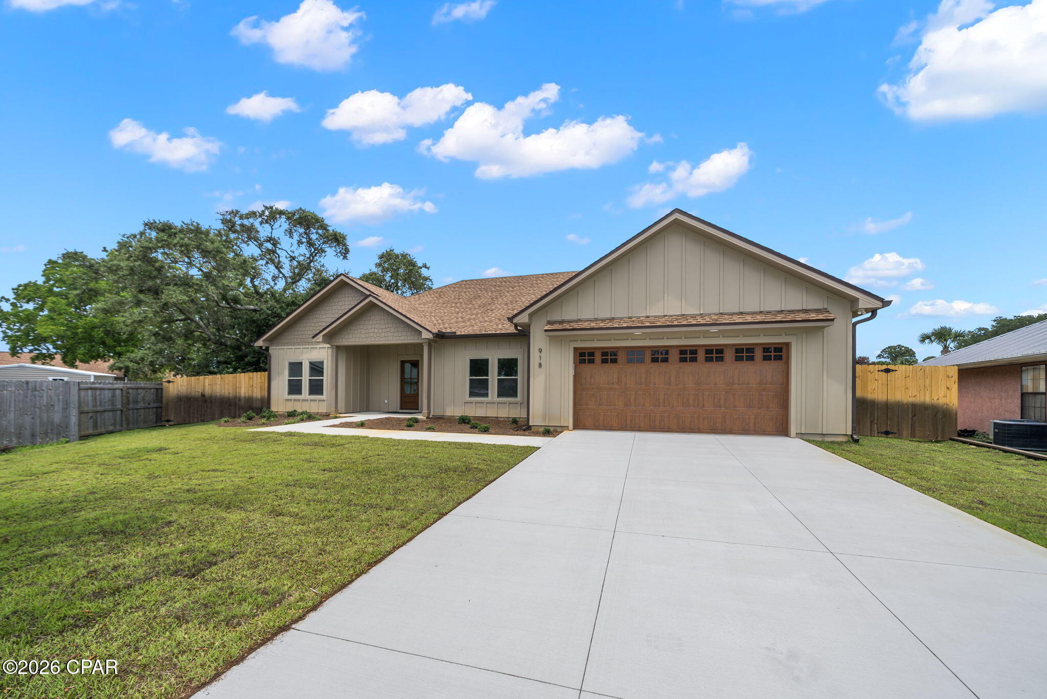 Discover coastal living at its finest in this stunning Coastal Contemporary! Situated in a private cul de sac just off GRAND LAGOON, this NEW CONSTRUCTION home offers the perfect retreat while remaining only minutes from top Panama City Beach attractions, white-sand BEACHES, the Navy Base and GREAT SCHOOLS.
On the inside, an open floor plan is designed for natural light and seamless indoor-outdoor living. The GREAT ROOM includes a spectacular kitchen with upgraded cabinetry,  
SLEEK STAINLESS APPLIANCES, beautiful Quartz counter tops, PERFECT FOR ENTERTAINING!  A warm wood feature wall adds drama to the neutral palette. The spacious master suite includes a decorative tray ceiling and recessed lights, A well appointed walk in closet with custom shelving and an elegant bath with a luxurious walk in shower and double vanity. 
The split floor plan includes a private hallway with 2 guest bedrooms and a guest bat. A 4th bedroom is located off the entry and would make a great private home office or den.
An  oversized privacy fenced yard is accessible from the covered porch just off the living area. Plenty of room for a pool! The yard has a new irrigation well and sprinkler system. 
New construction allows for years of worry free living, low insurance premiums and maximum enjoyment. No REQUIRED FLOOD INSURANCE  and NO HOA!
Don't wait to see this exceptional property that offers the rare combination of a peaceful, private location and proximity to the best of Panama City Beach.