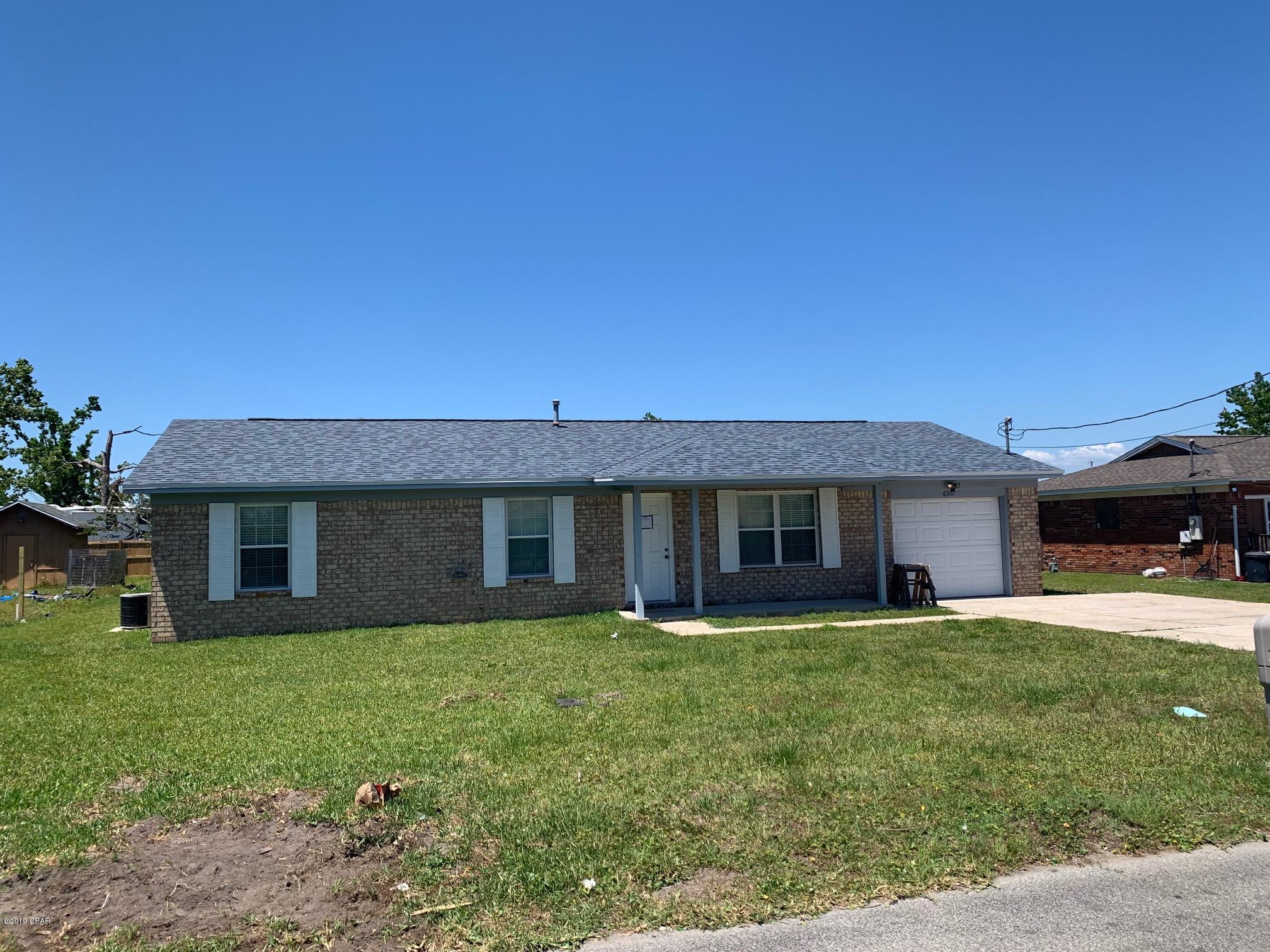 This 3 bedroom 2 bath home is located in Callaway, and features a 1 car garage, vaulted ceilings in the dining room, open kitchen with breakfast bar, granite counter tops, and a large Florida room with storage building in the back.