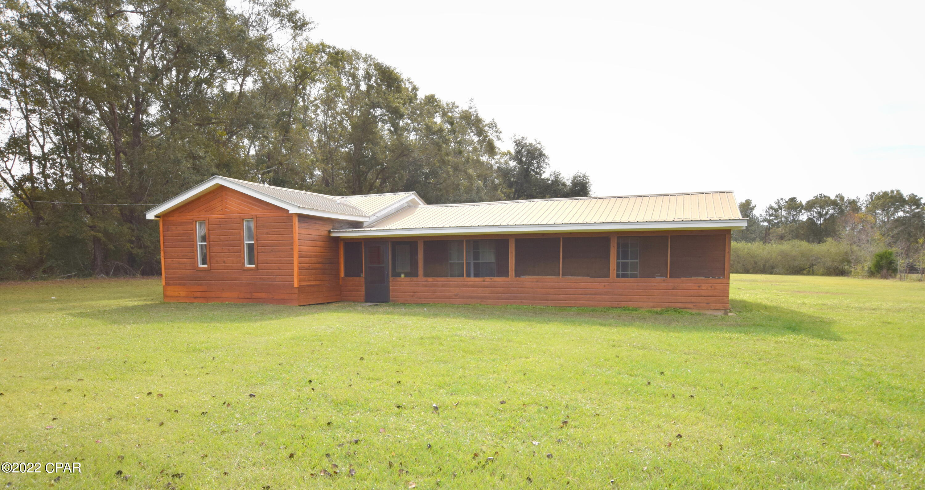 Situated in a relaxed, country setting just minutes from town sits this 4 bedroom, 2 bath beauty! Inside you will find a spacious living room with stained concrete floors, dining area open to the kitchen and master bedroom featuring custom wood beams with attached full bath. Outside features include covered front porch and detached shed. Property is conveniently located a short drive to Hwy 79 and Bonifay.