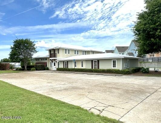 Professional office building with 11 offices downstairs, reception/lobby area, conference room, three restrooms, copier supply room, storage closet, storage area, kitchen breakroom, and upstairs has 4 offices.  Parking located in the front and back of the building. Lighted signage on Hutchison Blvd. Beautiful landscaping around the building with great curb appeal. Many possible uses for different businesses.  Presently a real estate company that is moving to a new location.