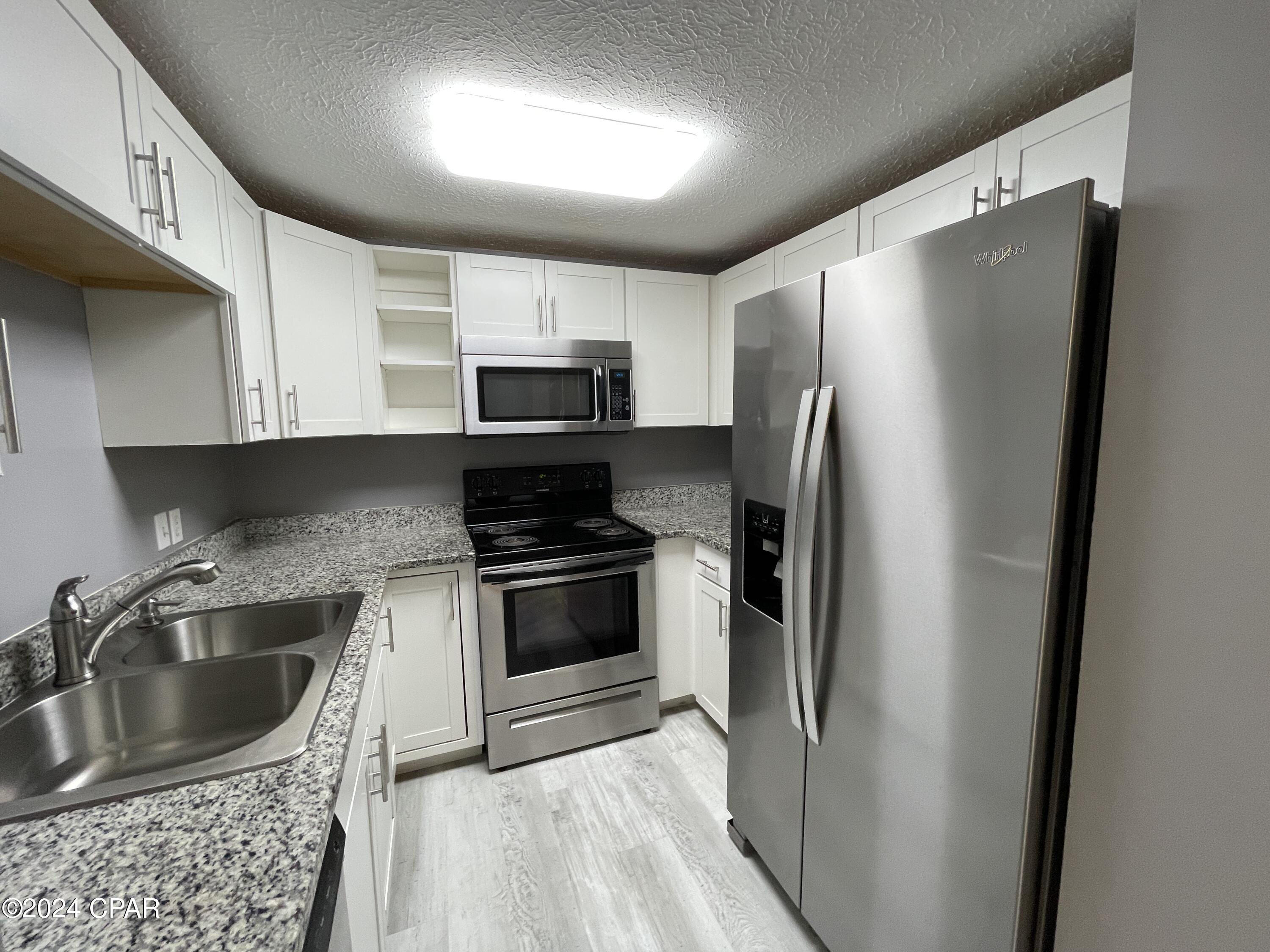 For Lease - Nicely updated 3 BR, 2 BA townhome in Lynn Haven! The townhome was updated with fresh paint, vinyl plank flooring, stainless appliances, and offers a split bedroom floor plan. The master suite is on the back side of the home and has a patio access door and an en suite master bathroom with tub/shower. The two additional bedrooms are on the front side of the home and have a hallway bathroom. Dining room is off the kitchen and has a back patio access door as well. The back patio is great for a grill and dining set with a privacy fenced back yard. *Pets negotiable under 25 pounds with $250 pet deposit and $25 monthly pet rent.
