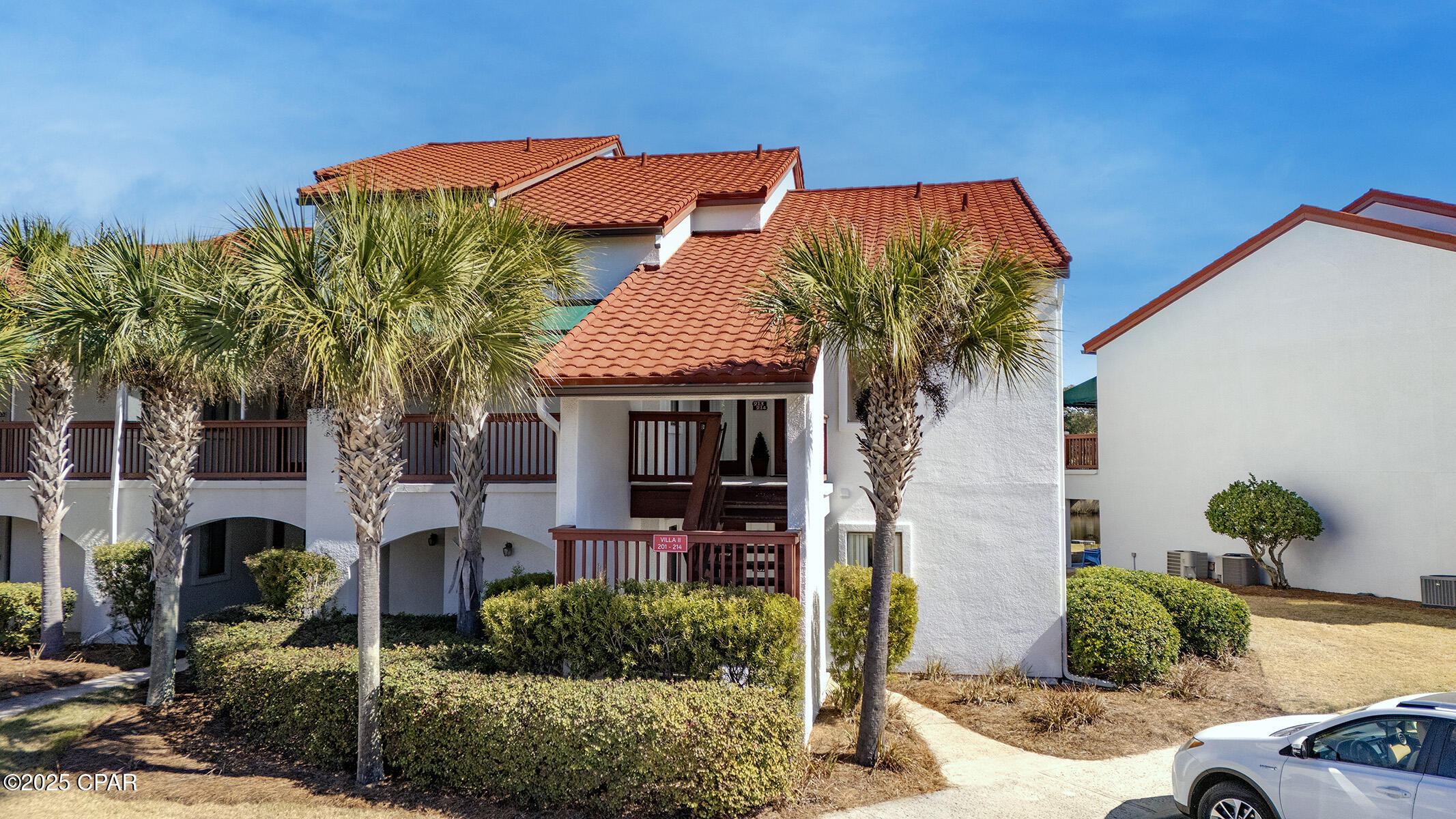 NEW PRICE, SAME BEAUTIFUL VILLA! Experience coastal living in this beautifully decorated waterfront villa, perfectly positioned for relaxation and adventure. The expansive primary suite offers amazing Lagoon views and an en-suite bath with a double sink vanity. A versatile loft bedroom adds extra flexibility. Ideal for hosting additional guests. The open-concept living and dining area is perfect for entertaining, with a breakfast bar for added casual dining. A downstairs bedroom with a full bath ensures convenience and privacy. Enjoy community amenities, including a pool, pickle ball/tennis courts, and dock with easy Bay and Gulf access. Boat parking is available. Convenient access to beach, dining, shopping, and the Navy base, this villa offers both comfort and investment potential. View this one in person in between the rental guests, fall in love, and make an offer we can't refuse!