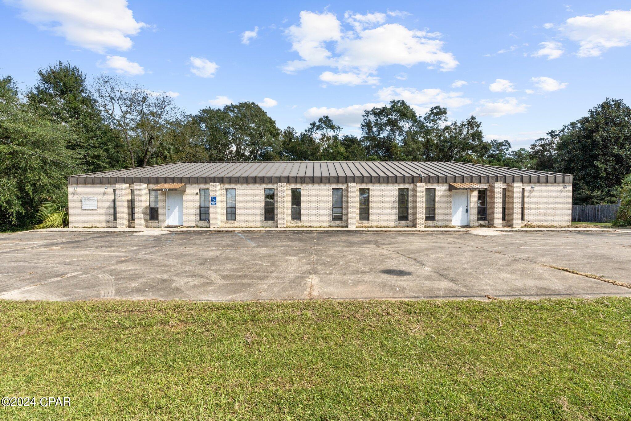 Discover the endless potential of this versatile, handicap accessible, 2-unit commercial office complex, conveniently located just one block from Hwy 79 and Hwy 90. Originally designed as a doctor's office, this well-maintained brick building is perfect for a variety of professional uses. Each office suite offers an identical layout, with one fully furnished and the other ready for your customization. Each side features a large waiting room with two public restrooms, a reception area with an additional private restroom, six spacious exam rooms (each with sinks), and an oversized private office. Separate HVAC systems ensure comfort year-round, and the commercial-grade standing seam metal roof provides durability and easy maintenance.

With 18 parking spaces, including two handicap-accessible spots, this building is ideal for any business. Whether you're looking to establish a medical office, daycare, beauty shop, or even state or government offices, this space offers incredible flexibility. The duplex layout allows you to operate your business on one side while generating rental income from the other. Its versatile design also makes it suitable for insurance agencies, home health care, construction offices, or card and bank processing centers.

Located just one block off major highways, this prime location offers easy access and visibility for your business. Don't miss out on this incredible investment opportunity—call today to schedule a showing!